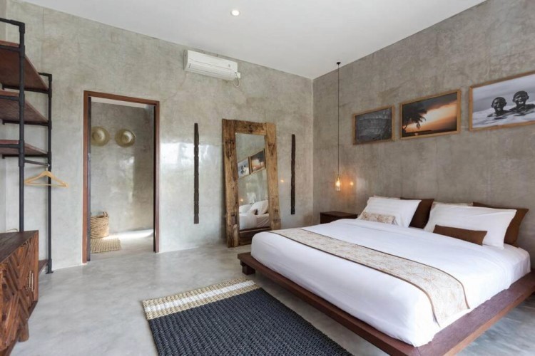 sunloungers fronting buildings near mountain