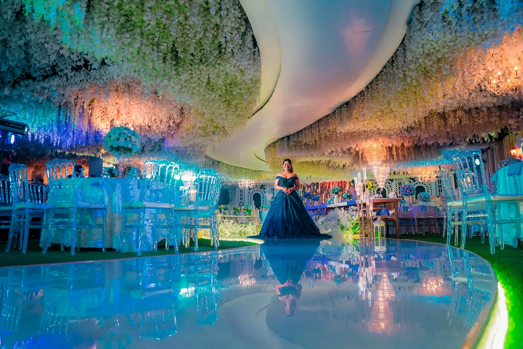 Blue-lit debut reception under the wisteria ceiling of Celestia Hall, Quezon City