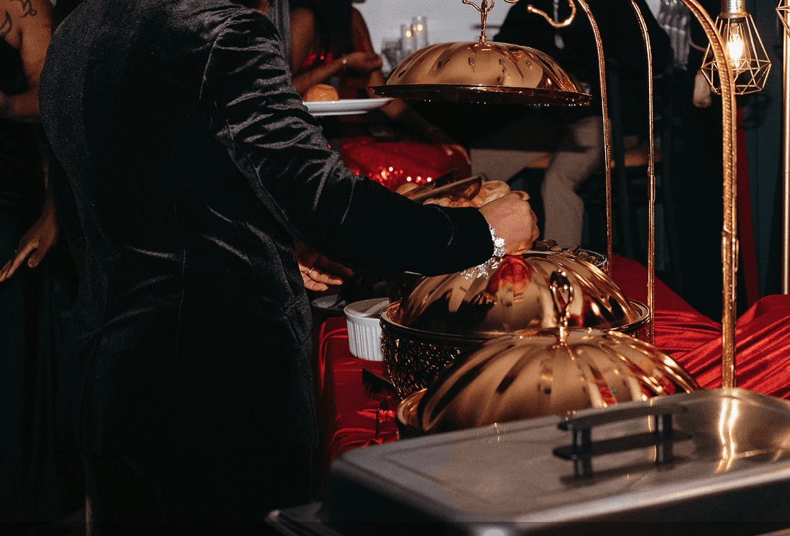 Chef plating food at event