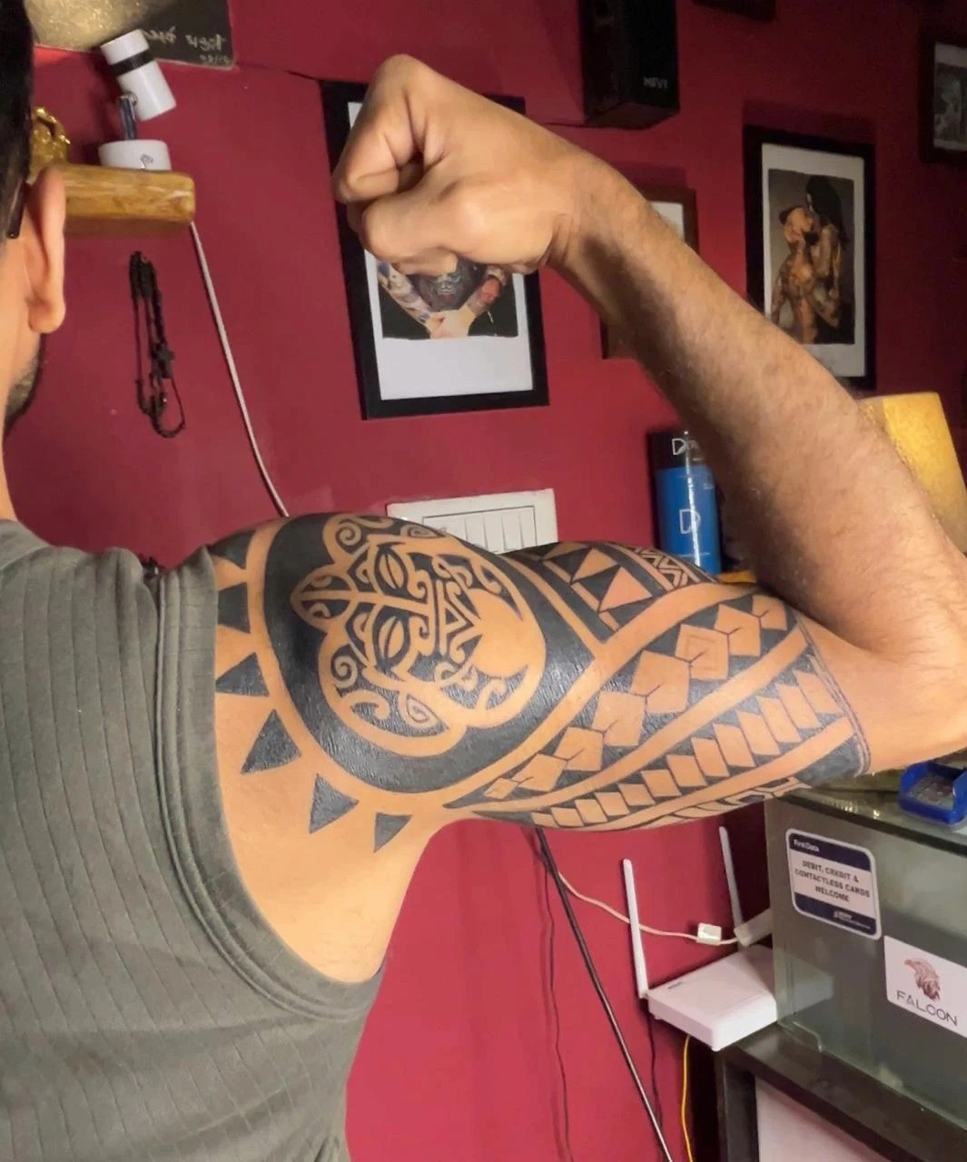 Polynesian and Maori full sleeve tattoo with intricate tribal patterns and bold blackwork, crafted by the best tattoo artist in Bangalore featuring a custom tattoo design with cultural-inspired detailing.