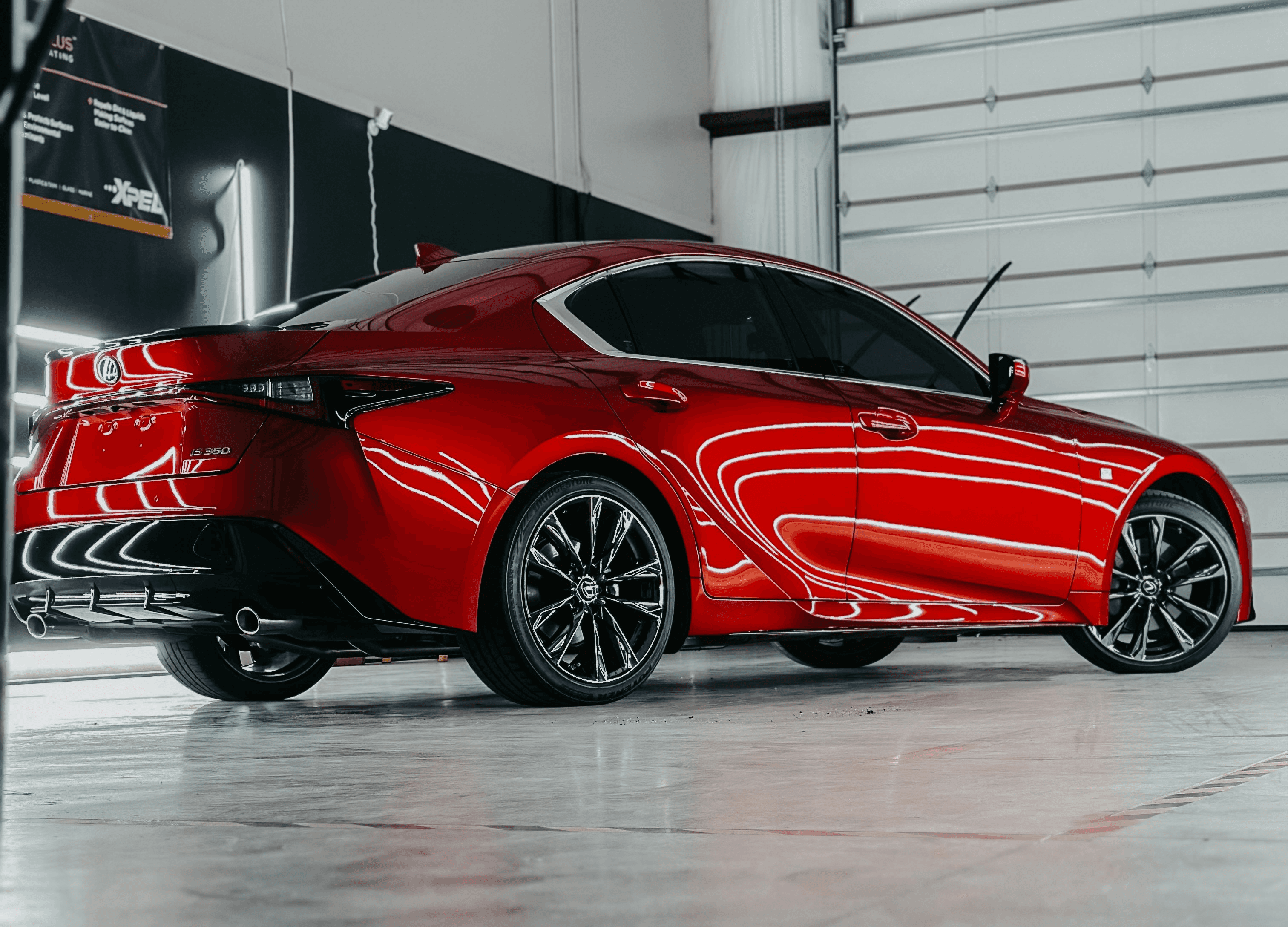 a red sports car parked in a garage
