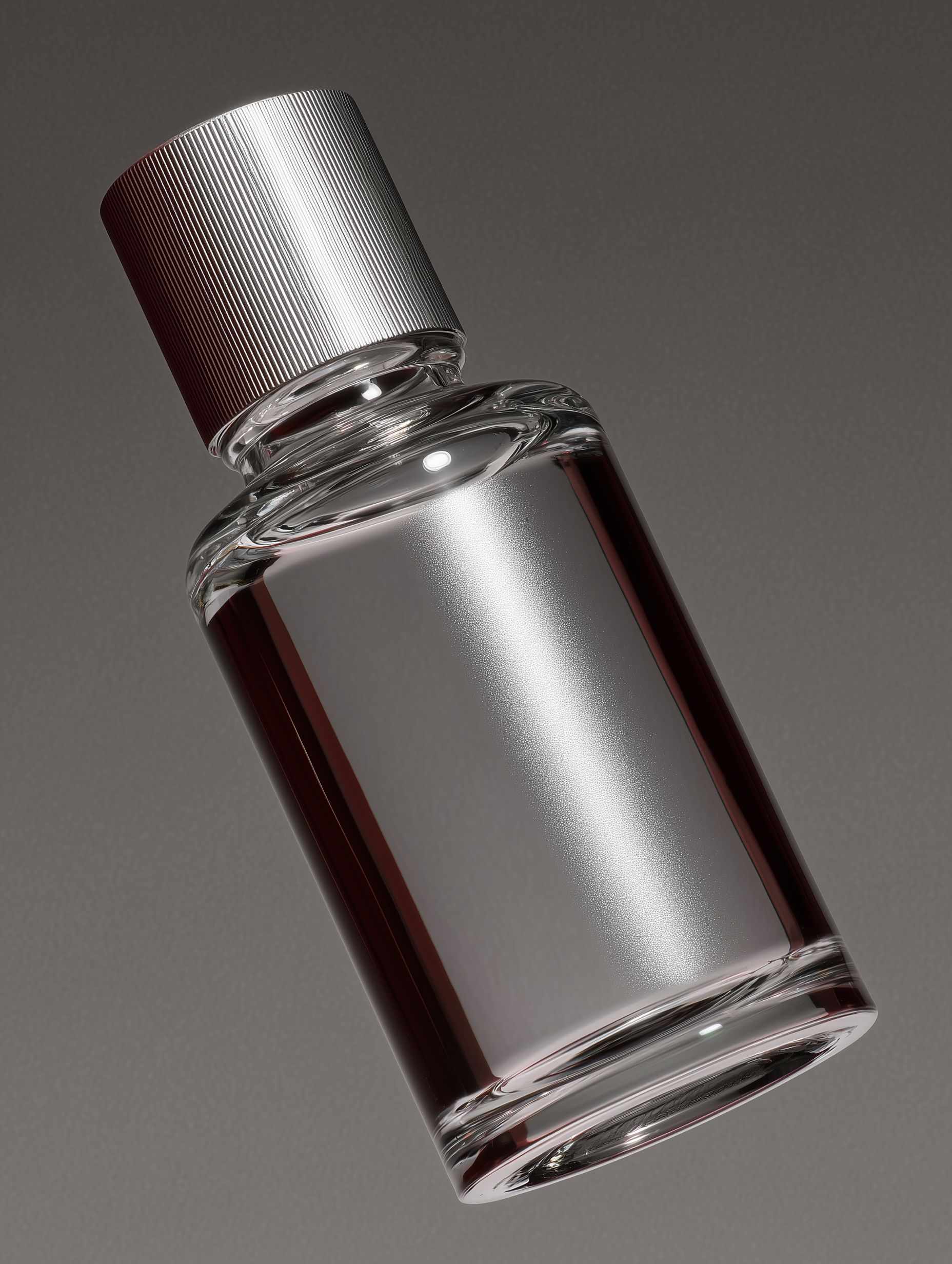 Glossy dark gray skincare product with reflective sparkle