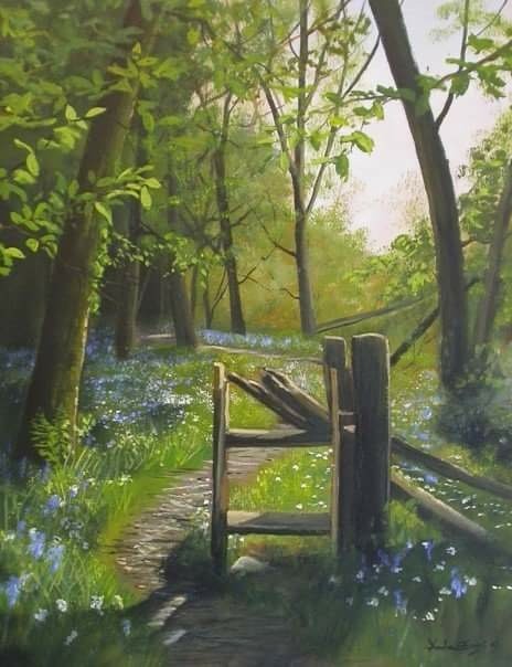 A thoughtful young person with dark hair gazes to the side, captured in soft black and white lighting.