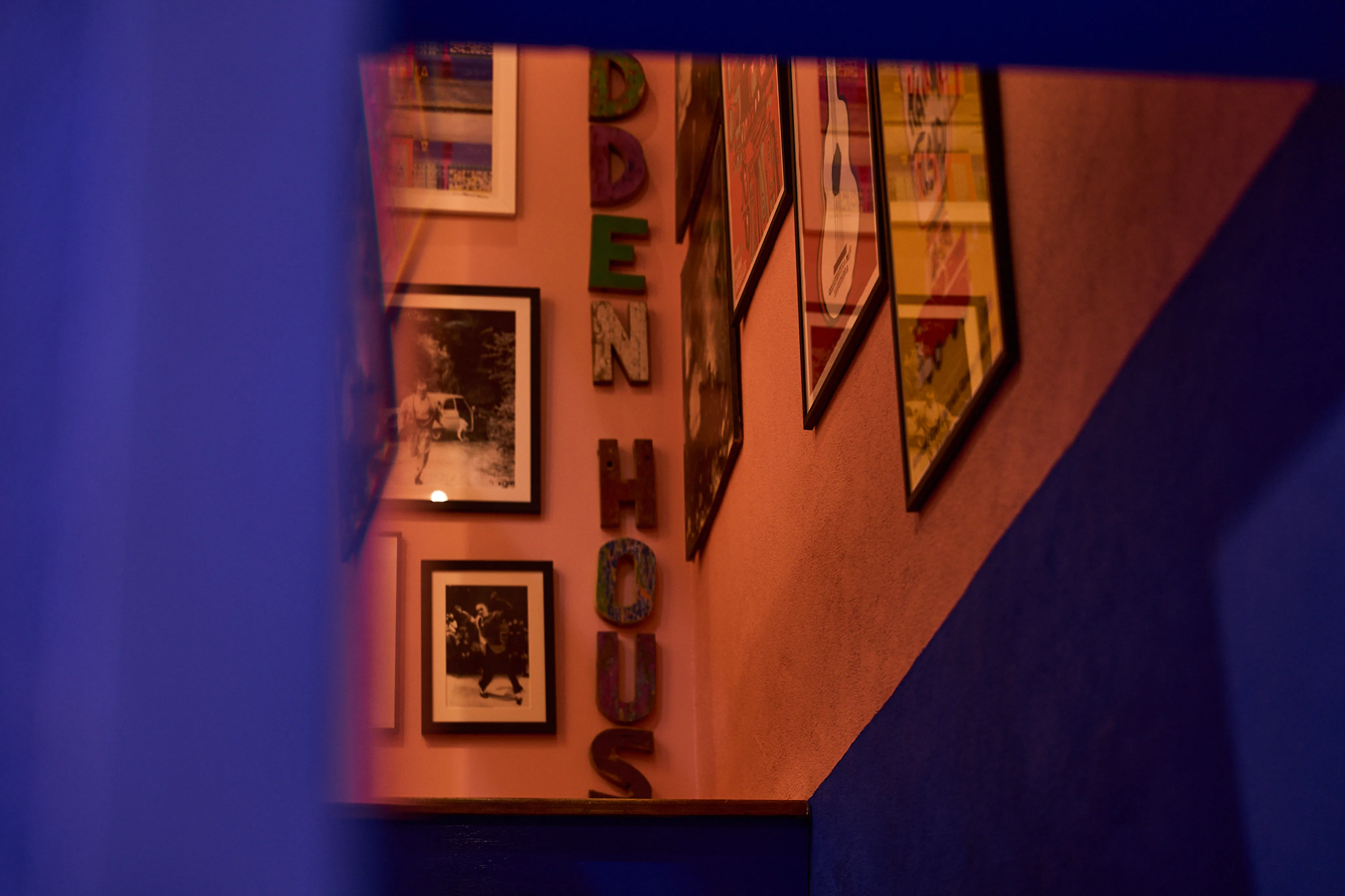 Hallway gallery wall with framed artworks and Hidden House lettering, boutique accommodation Stari Grad Hvar
