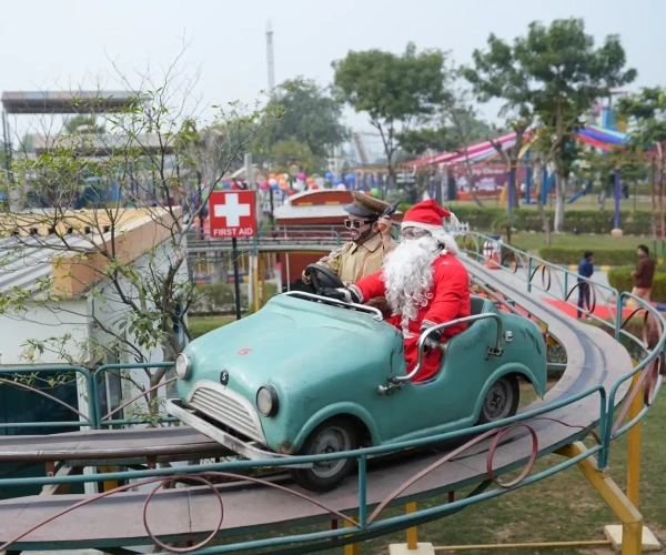 Sunlit minimalist hallway with staircase, wooden bench, plants.