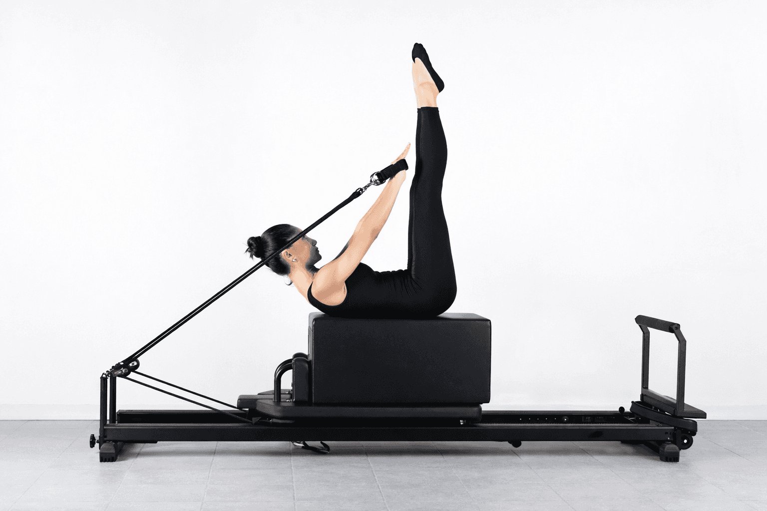 a woman is doing a piyoma exercise in a gym