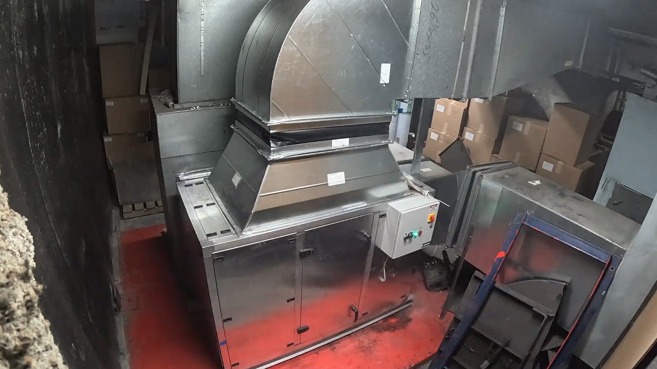 Completed return fan retrofit with new duct transition and control panel.