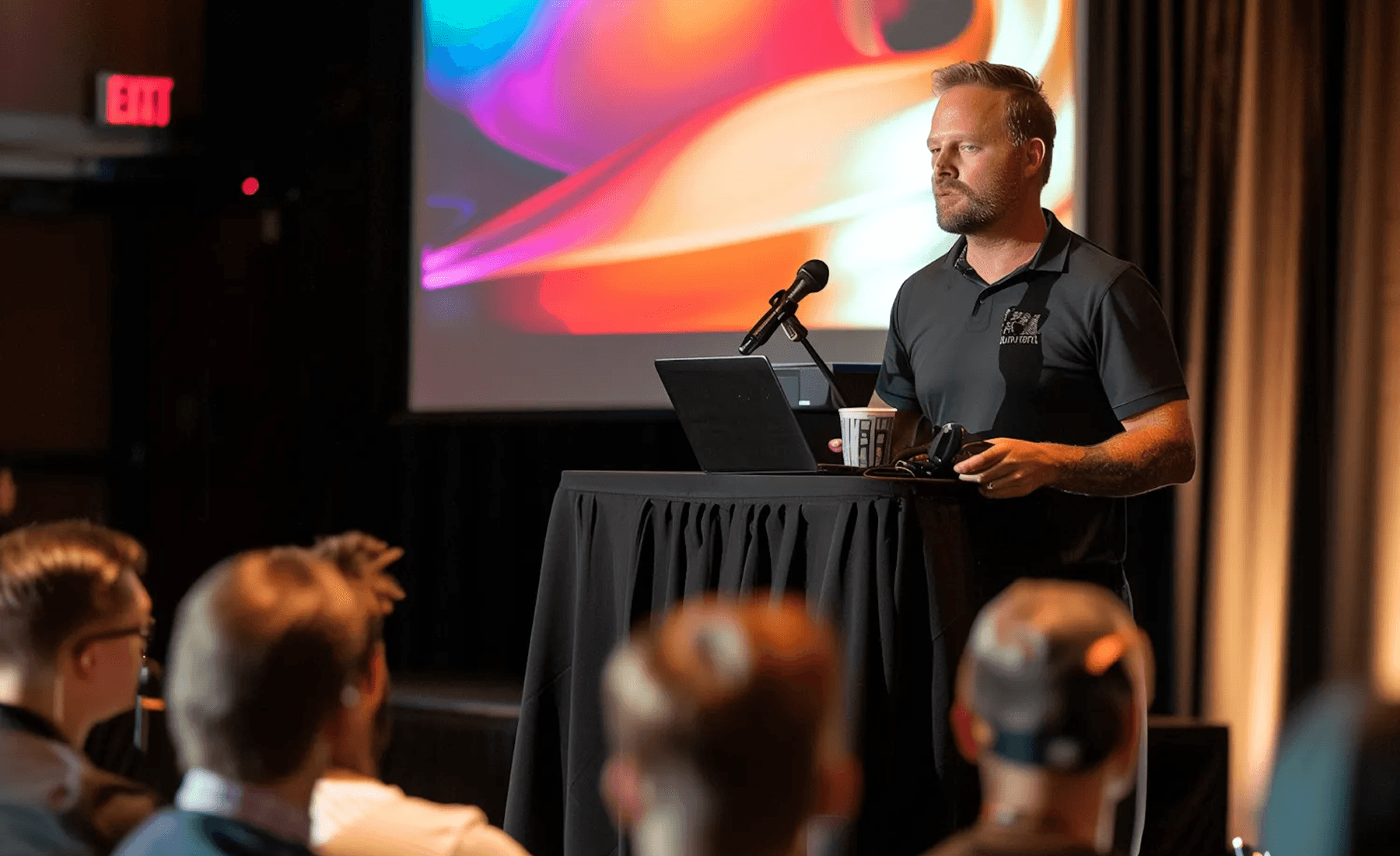 Man presenting at a lectern.