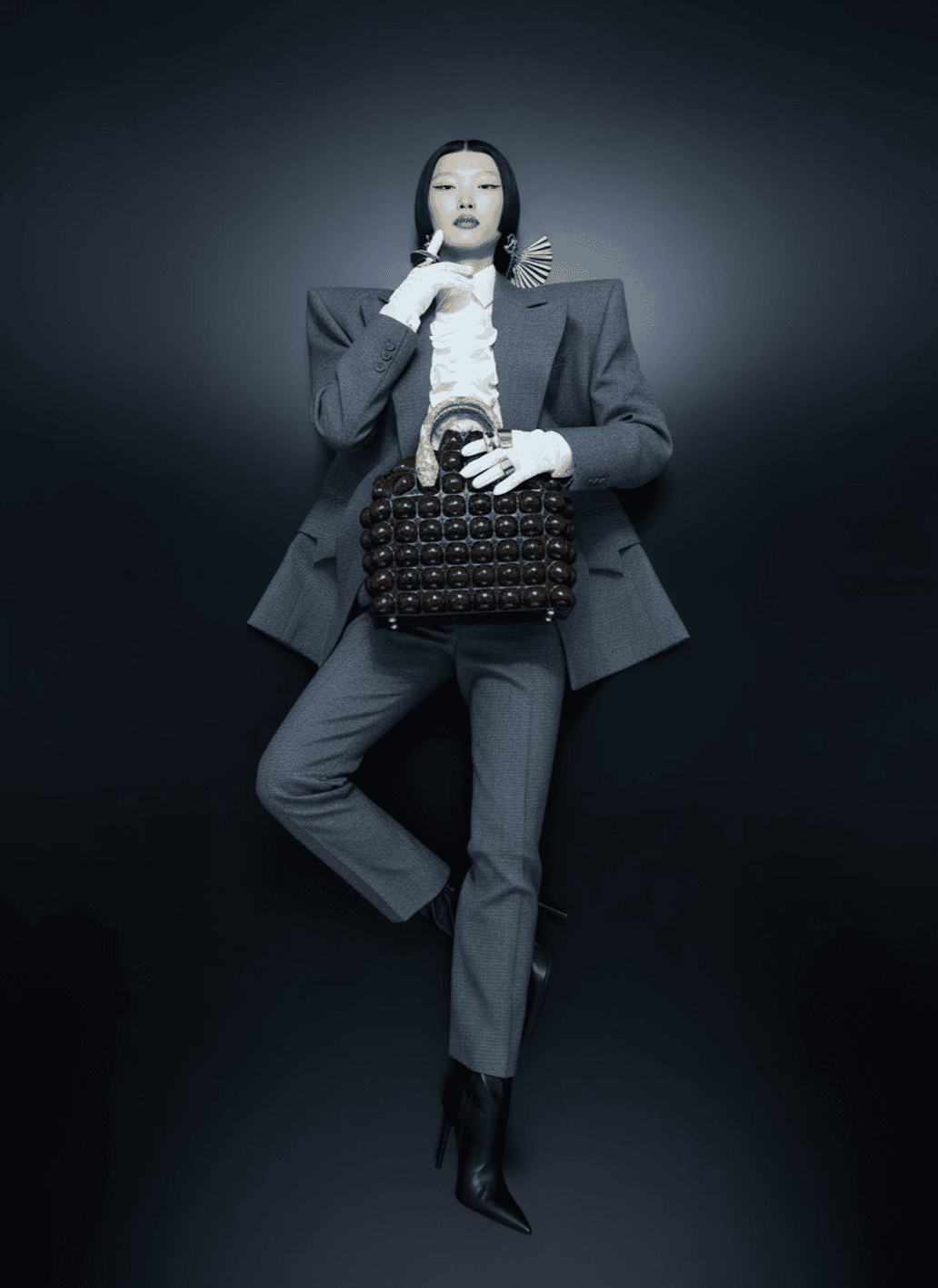 Woman laying down holding a purse