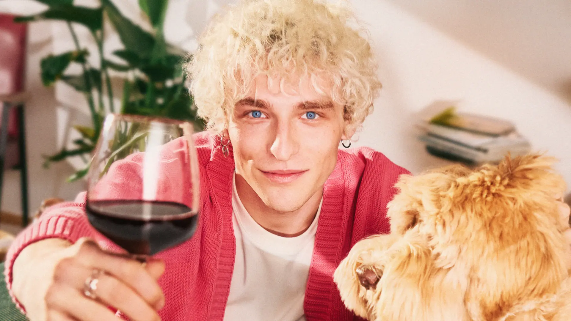Stack of modern books and magazine with minimalist cover design on leather chair