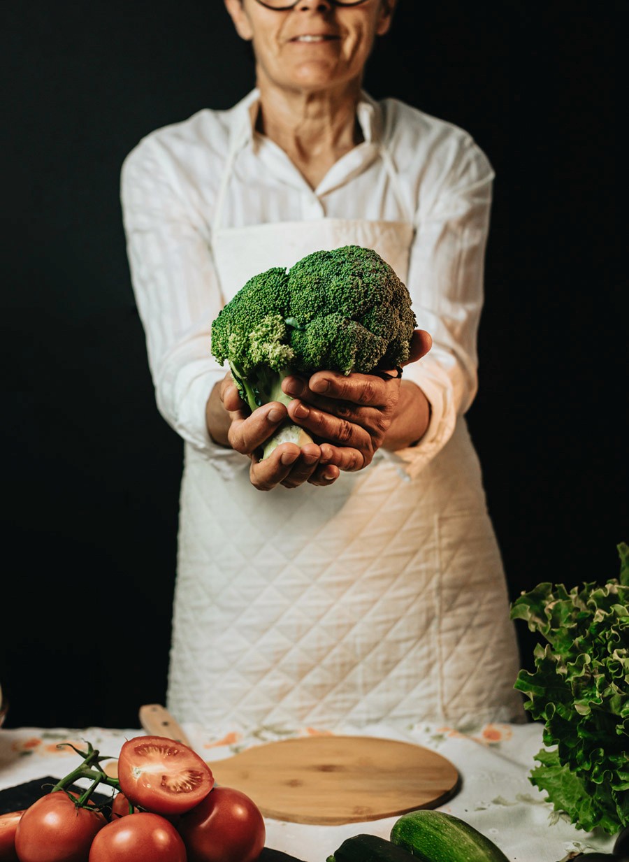 two ladies looking at a laptop and smiling
