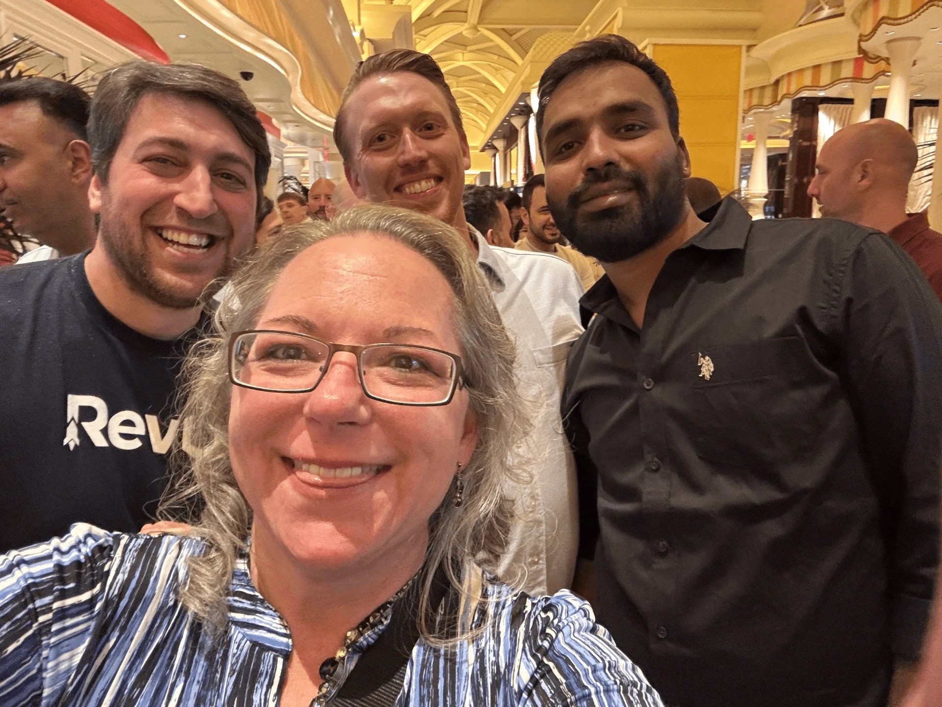 Smiling offerwall team members taking a selfie.