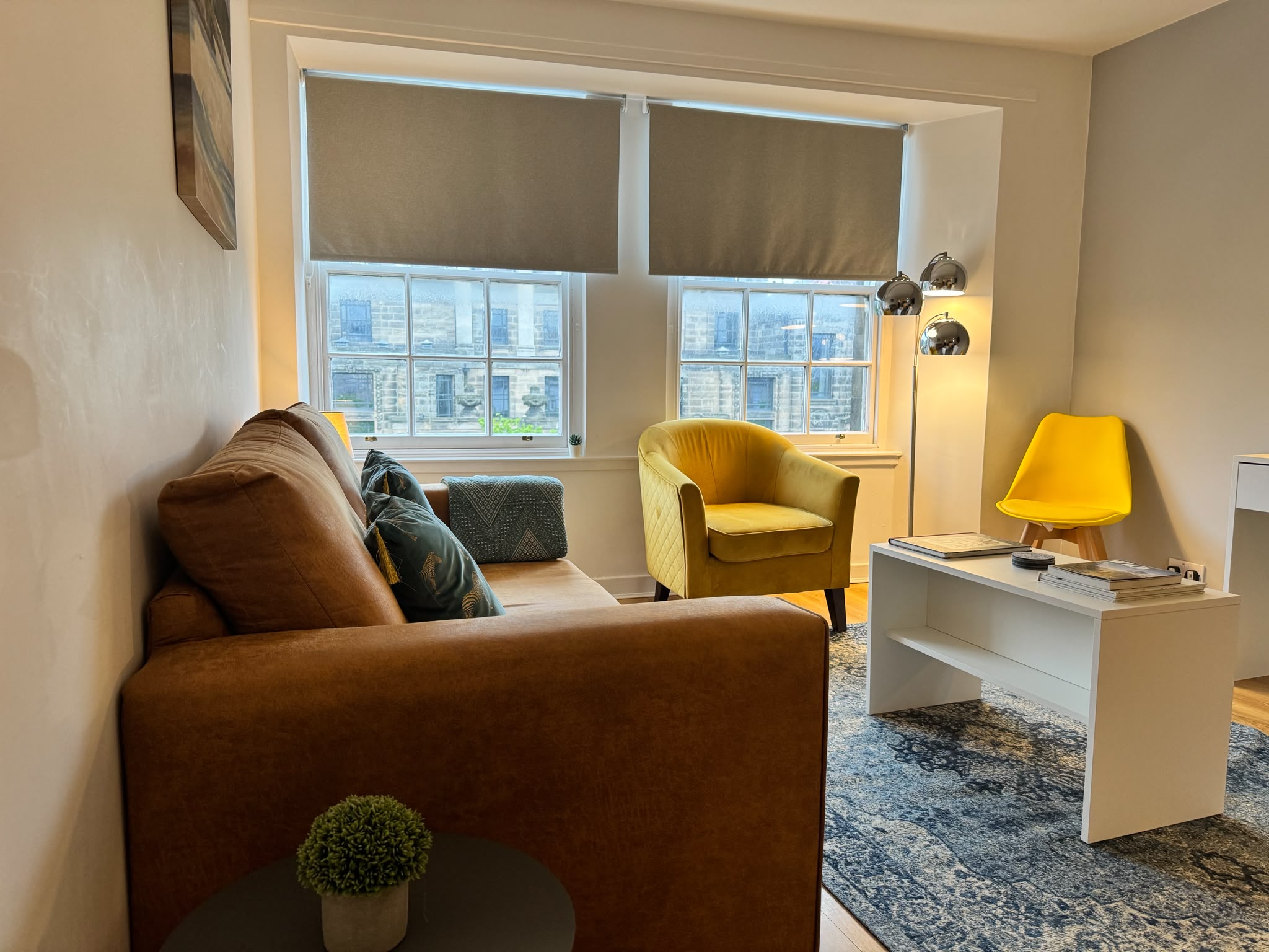 Living room at 52 North showing the sofa bed closed and the coffee table