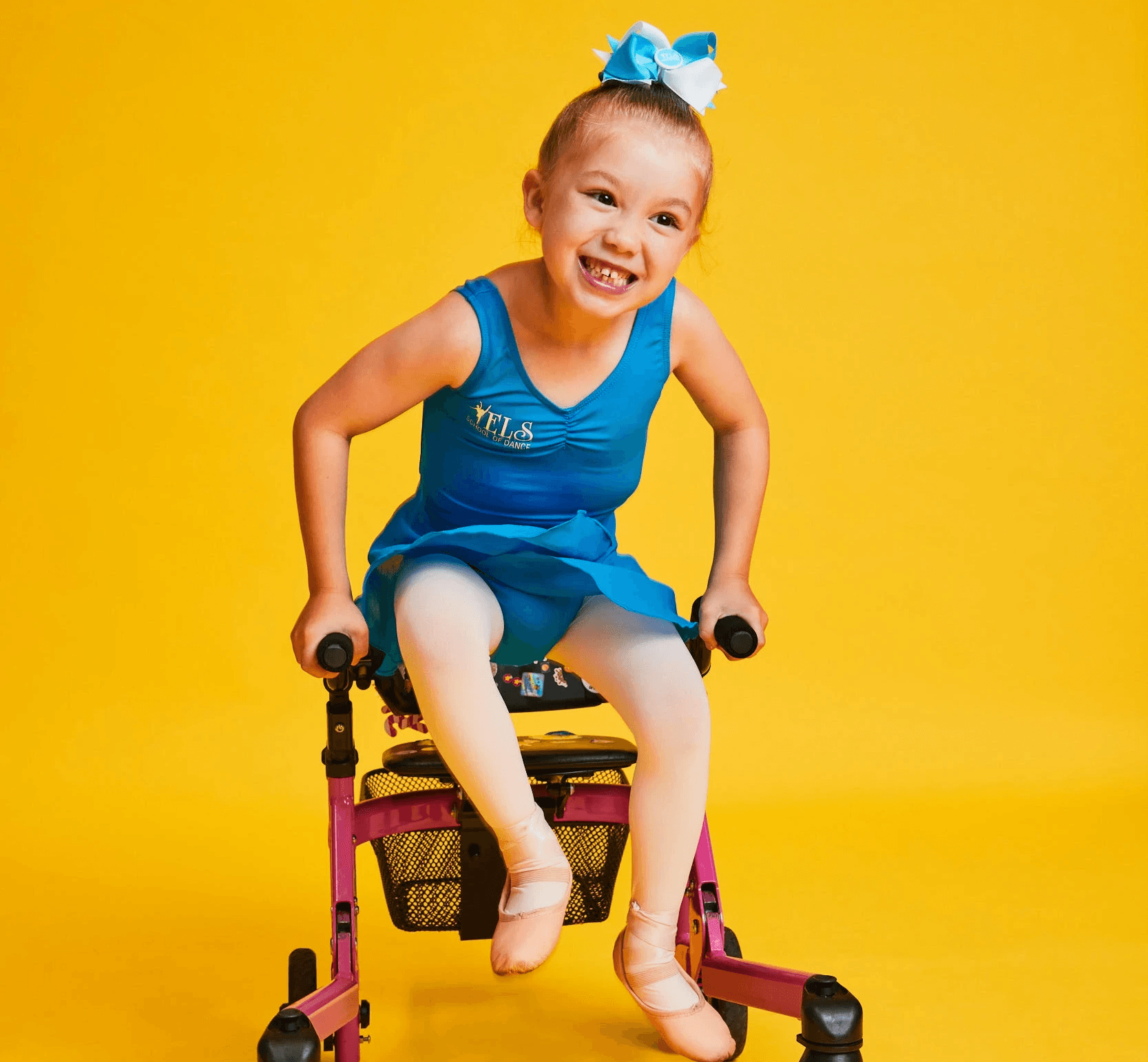 girl jumping with the aid of a walker