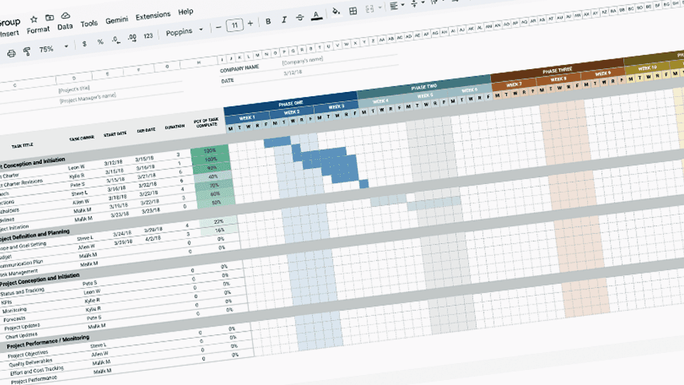 Two colleagues collaborating over paperwork at an office desk, with plants in the background.