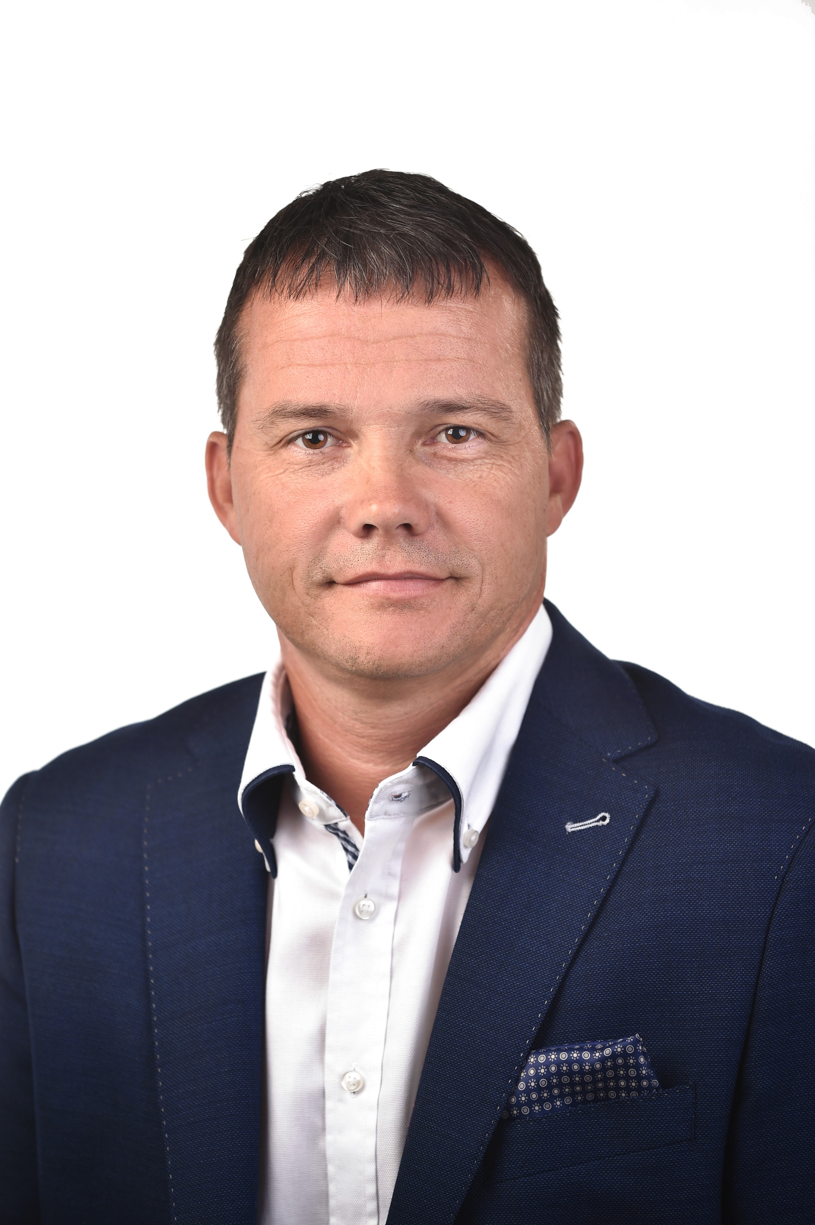 a man in a suit indoors