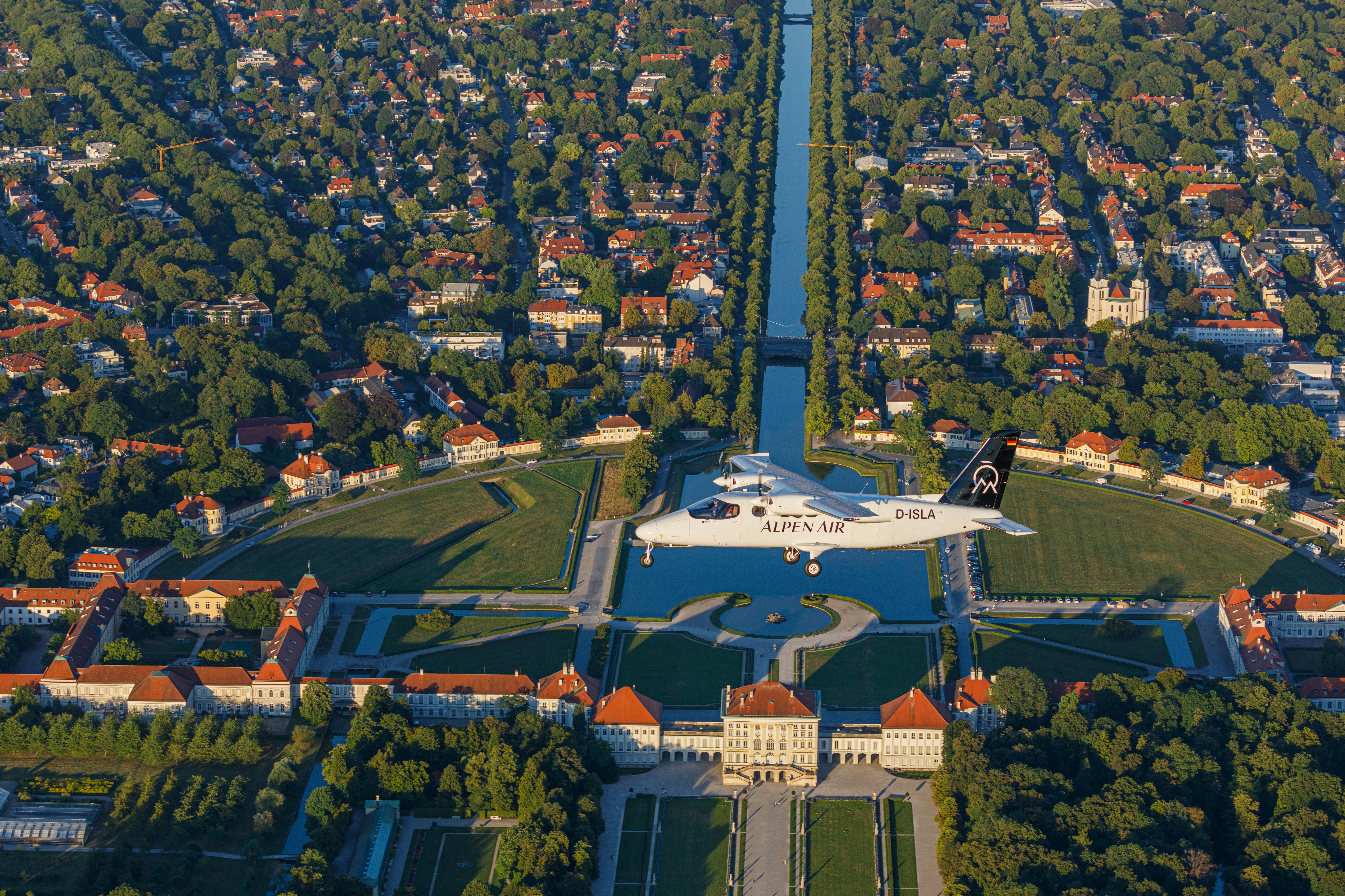 an aerial view of a plane flying over a city