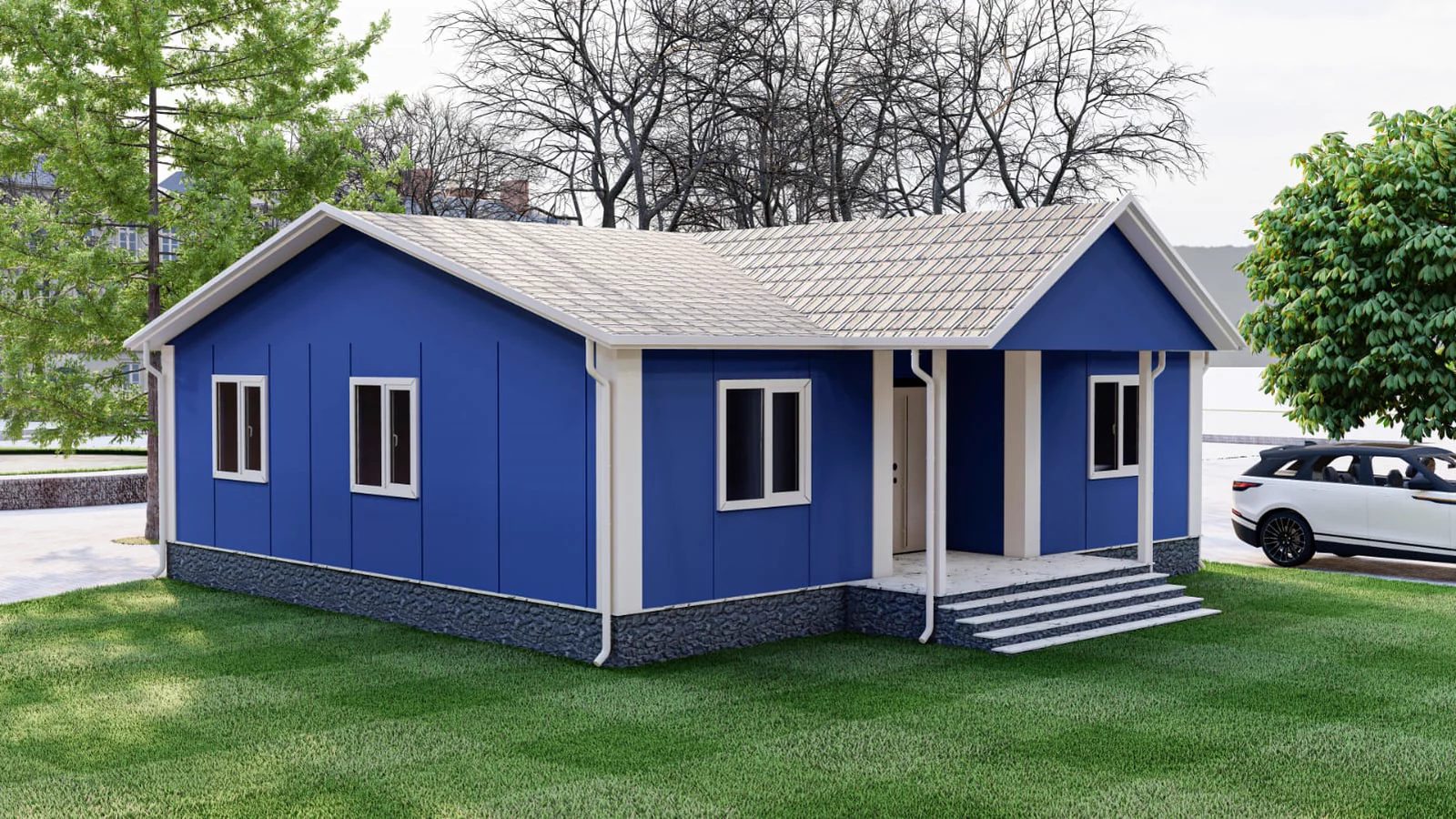 Prefabbricato moderno a un piano in blu, con ingresso coperto e perfettamente inserito in un progetto di paesaggistica curato.