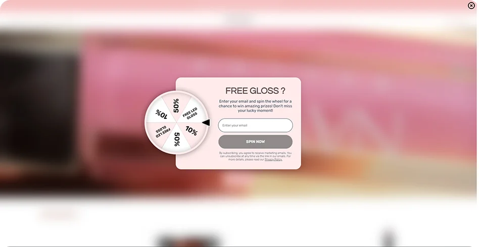 Gamified spin-to-win exit-intent popup for the Navas Bellus beauty brand, offering a free gloss to increase email subscriptions and conversion rates