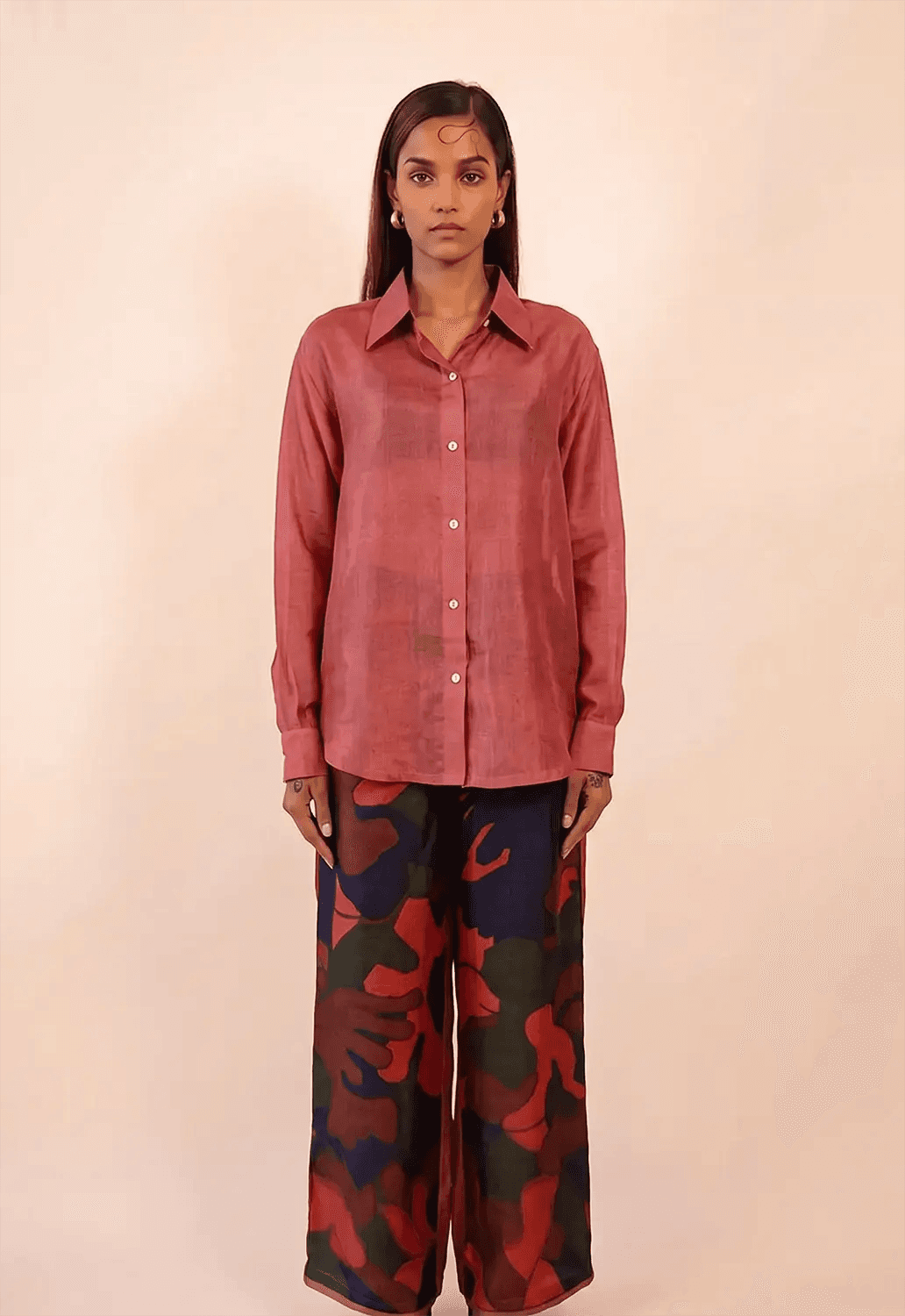 A relaxed co-ord set featuring a simple silk shirt, Designed for effortless wear