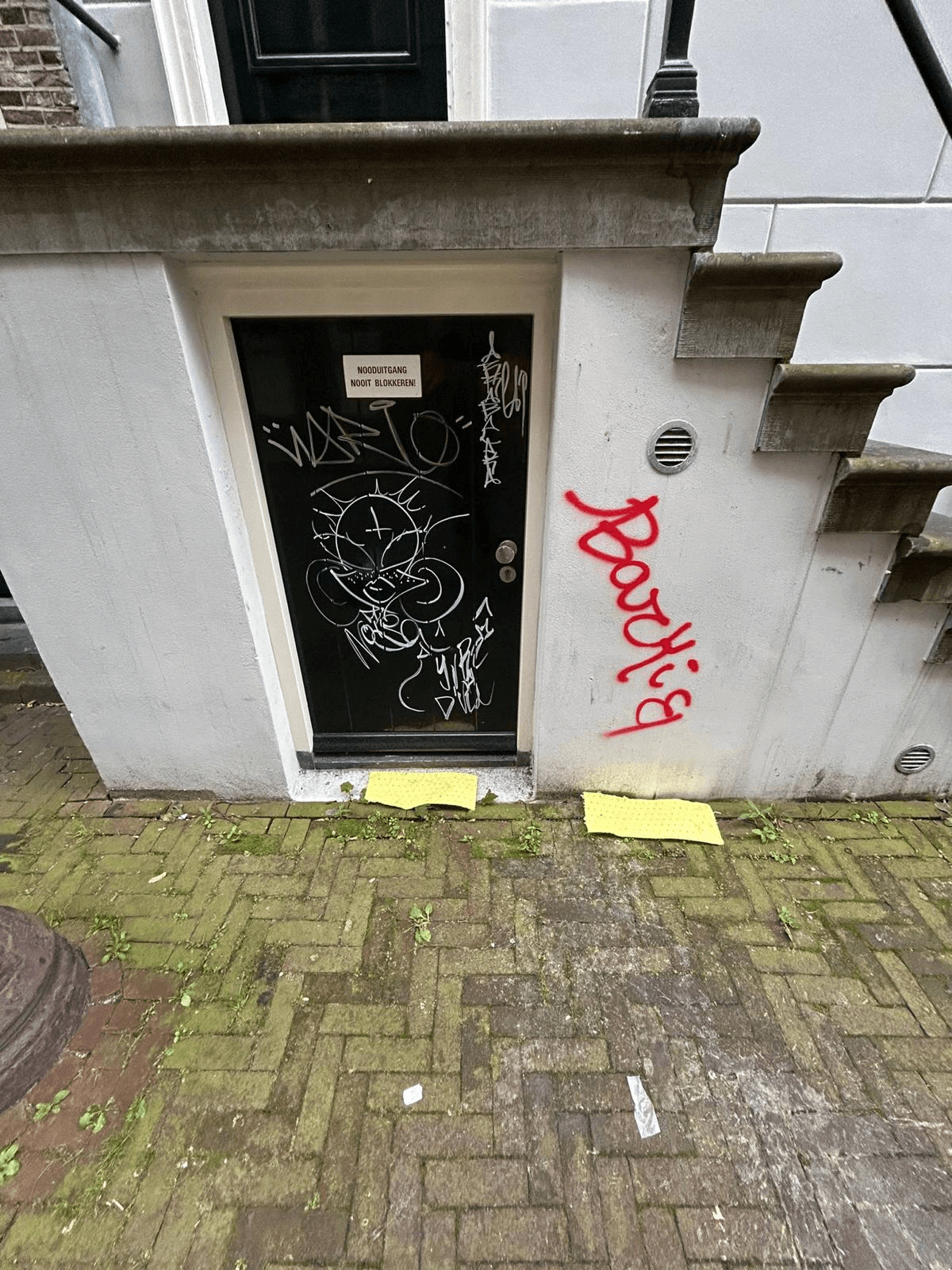 A diverse team collaborates around a table, analyzing documents and charts in a professional setting with a light green background.