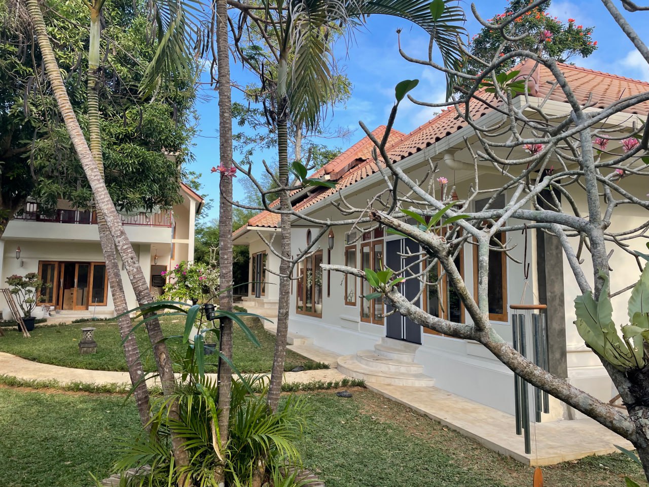 A 4-bedroom villa in a gated complex in Nusa Dua, featuring a large private garden and a peaceful residential environment