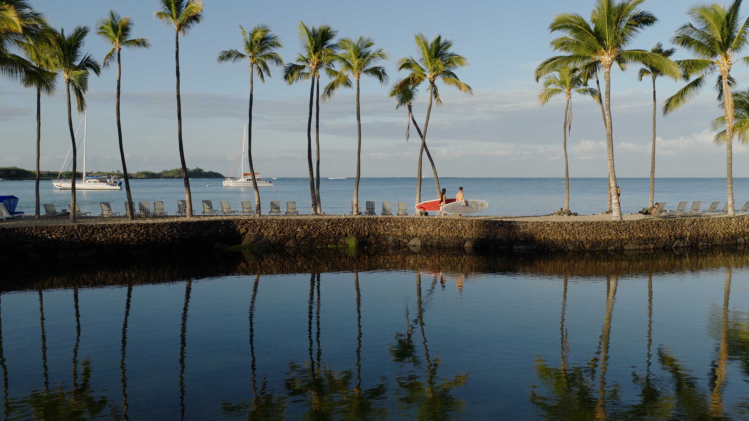 Streetside billboard with flyposters of the Batch.Works brand and illustrations