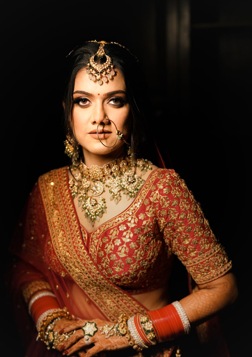 An intimate moment between a bride and her partner captured mid-kiss.