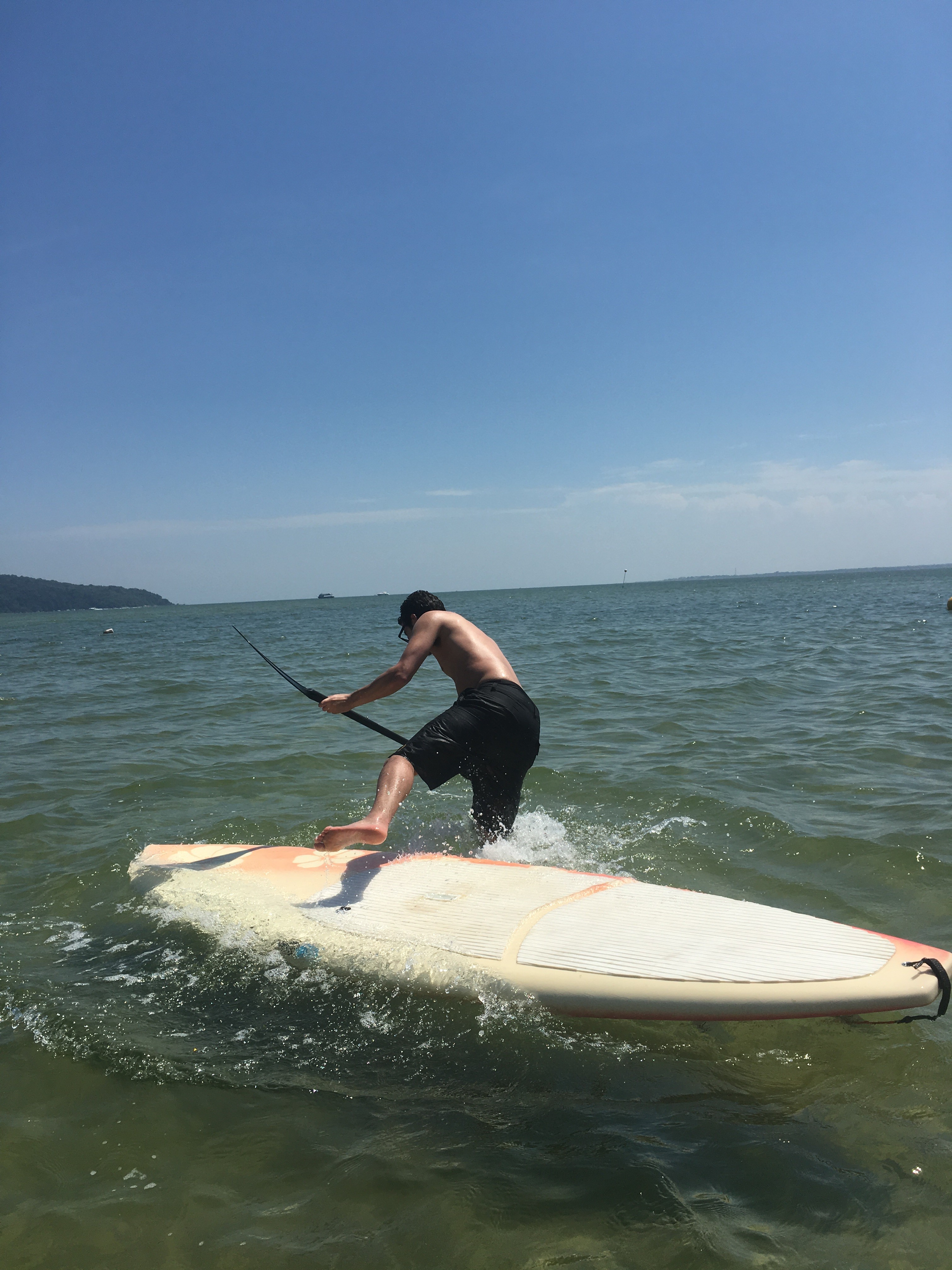Me falling off a stand up paddle board into the sea 