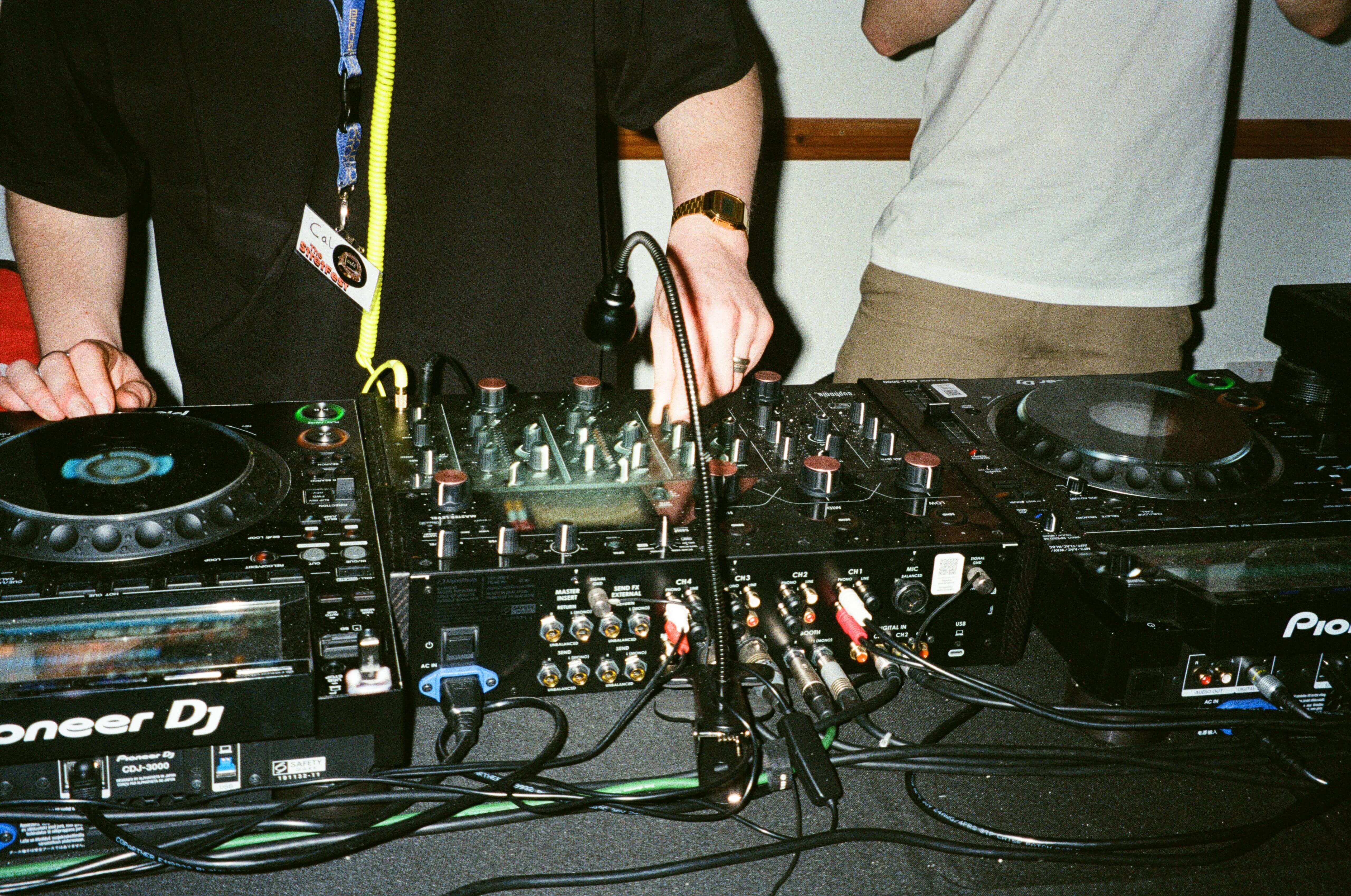 DJ set lighting up a crowd at a social club