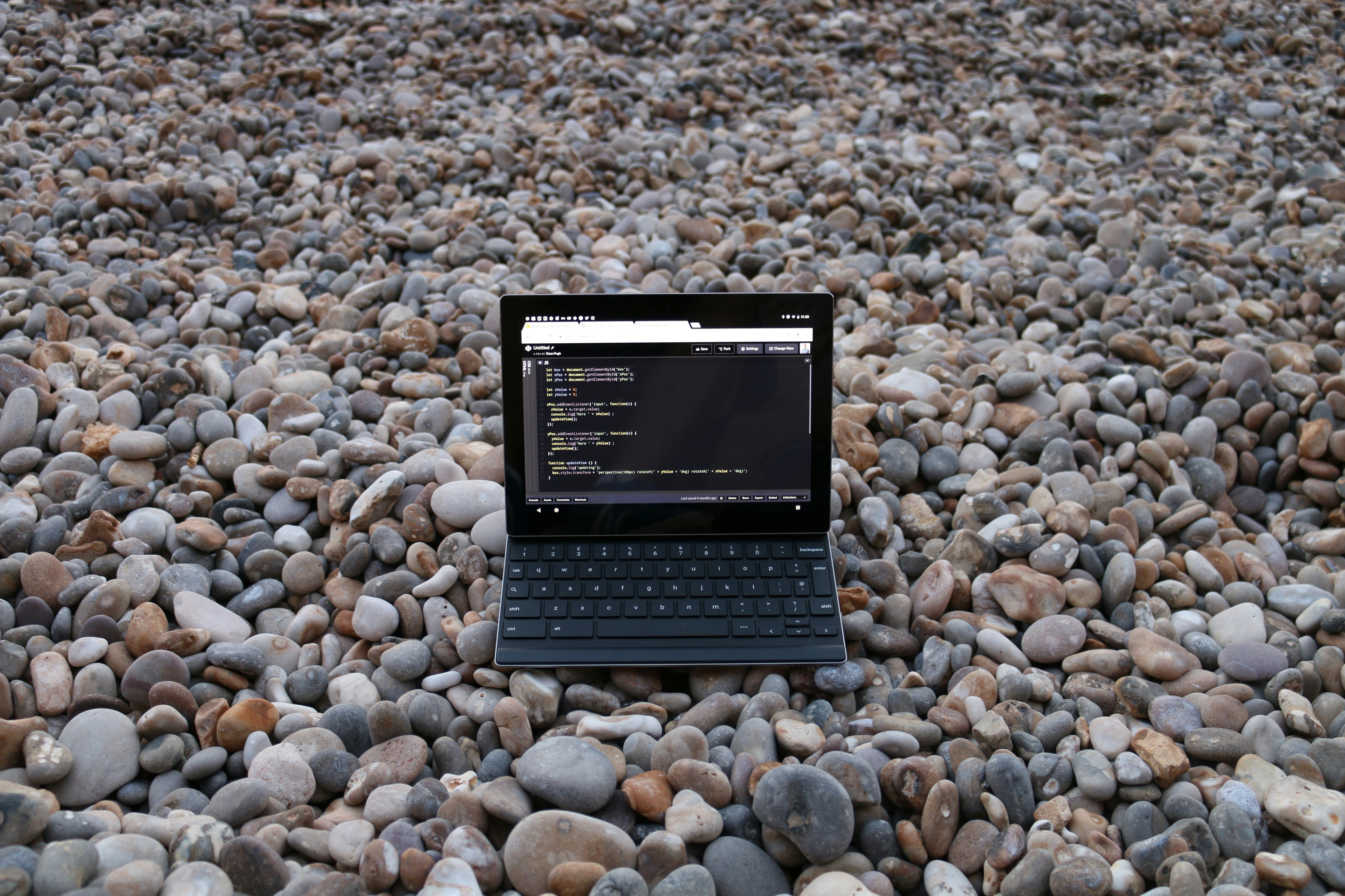 a small black device on a rocky surface