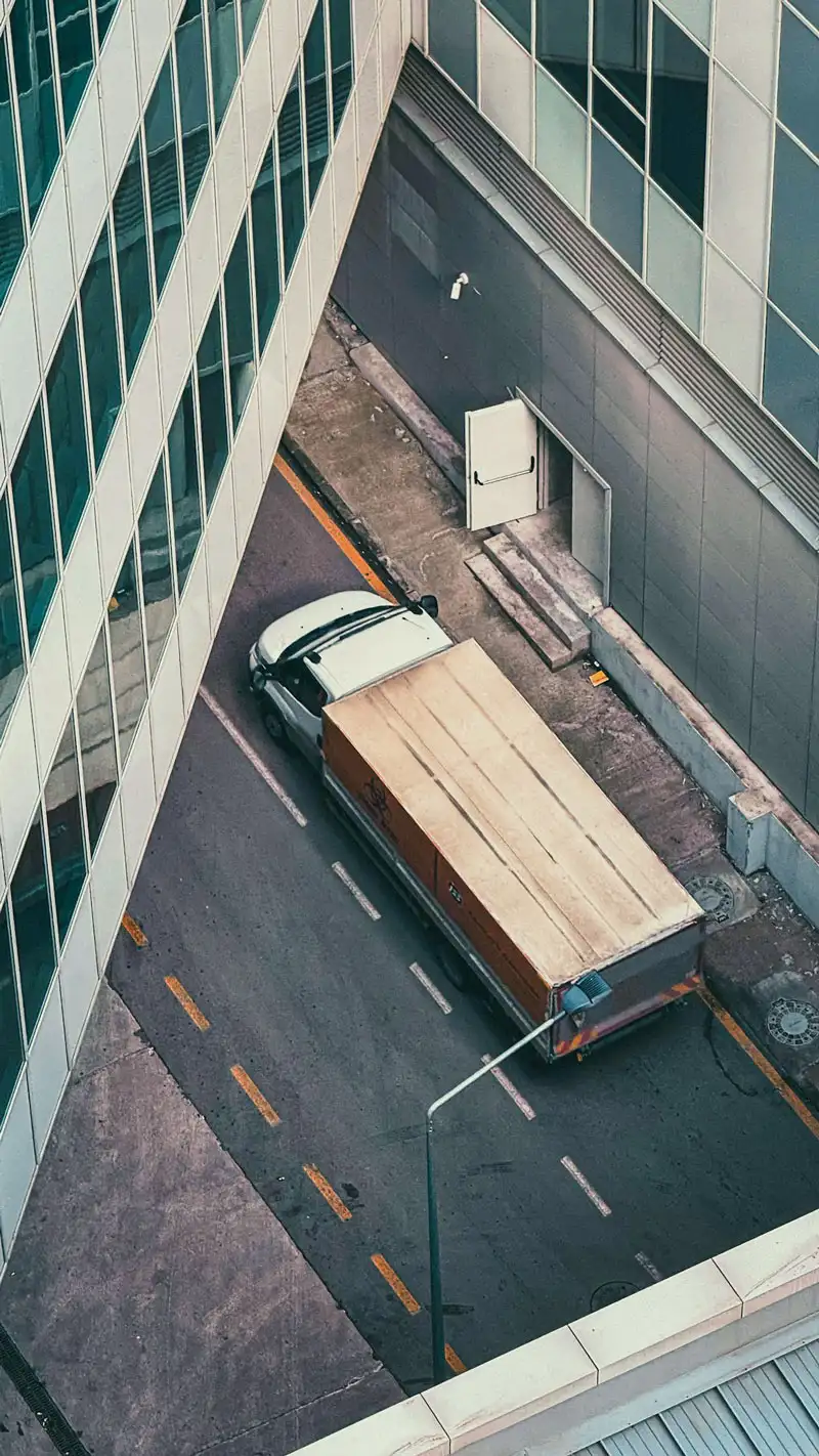 Moving Company Van Top View inside city.