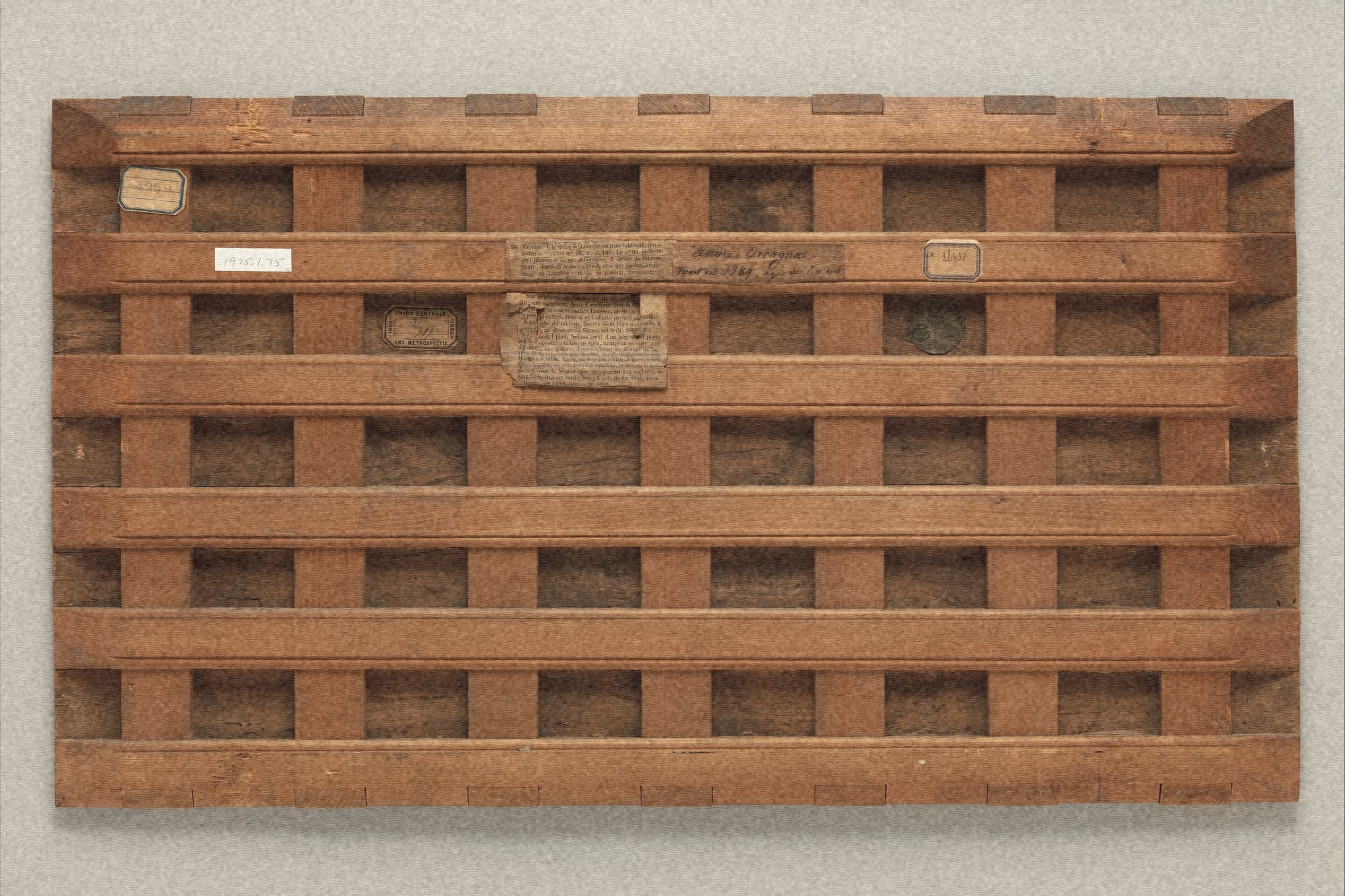 back of a wooden panel painting with a lattice cradle