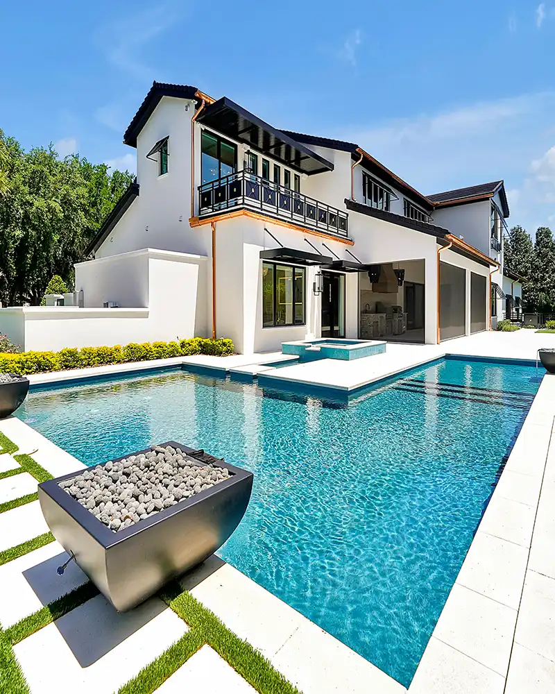 Experience luxury living in Florida with this stunning modern home featuring a pristine pool and elegant design, captured by skymedia360.