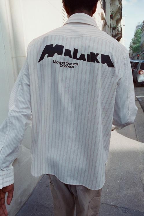 Image may contain Clothing Shirt Sleeve Long Sleeve Adult and Person