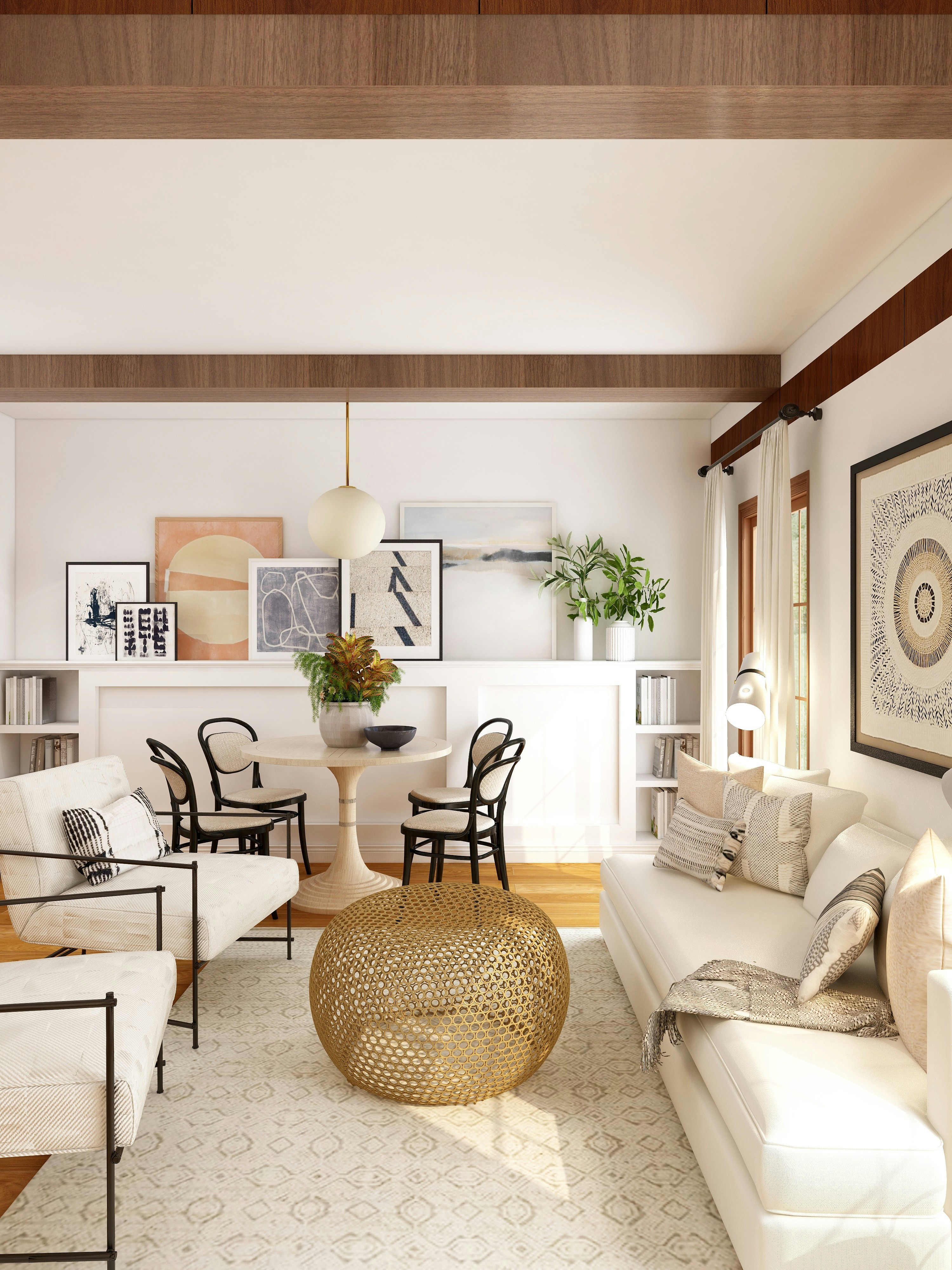 Warm open-plan living and dining space with gold ottoman, art ledge, and wood beams