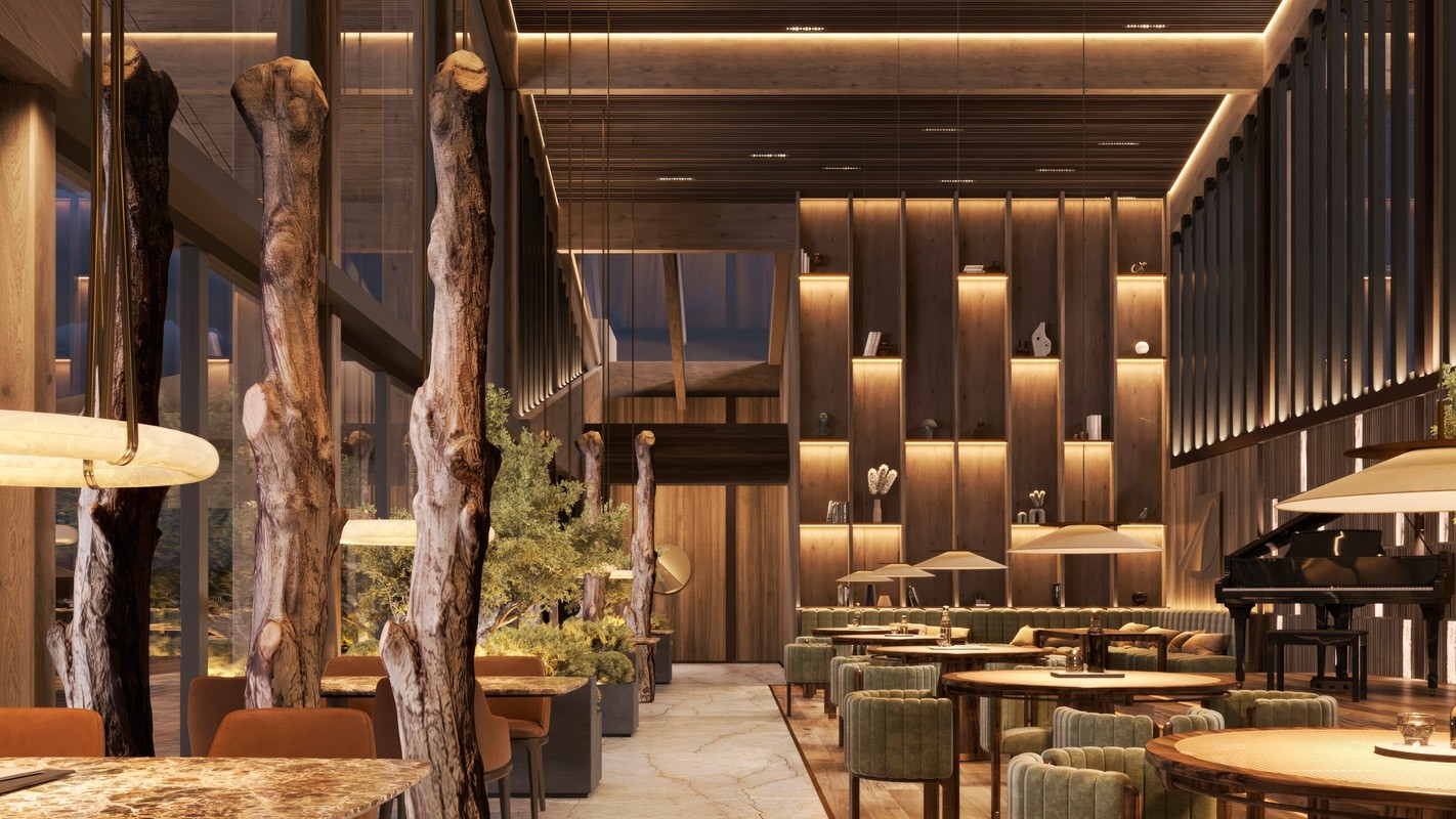 Peakside Chalets Cyprus restaurant lounge with double-height space, warm timber interiors, and ambient lighting