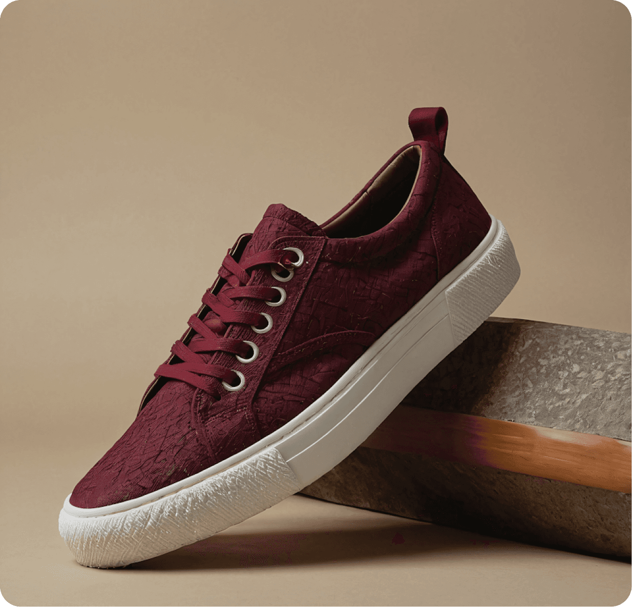 Burgundy leather sneakers with a white sole, showcasing a stylish and modern design suitable for casual wear.
