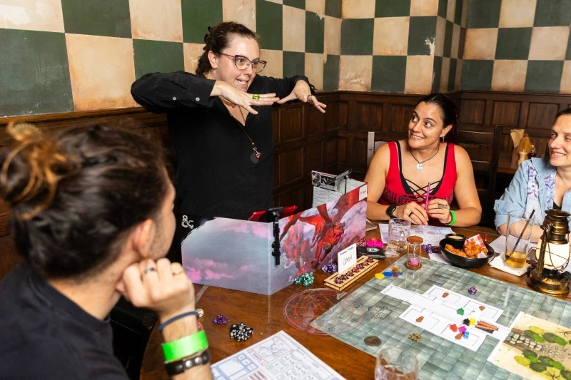 Dungeon Master explaining a part of the story to a group of players at Fortress Games