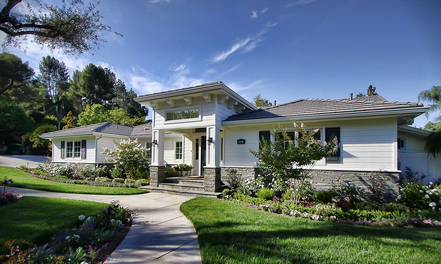 New facade of the home, showcasing the updated and modernized exterior.