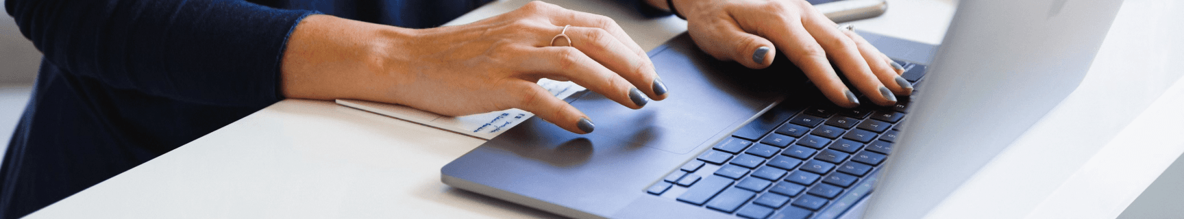 Woman typing on a laptop