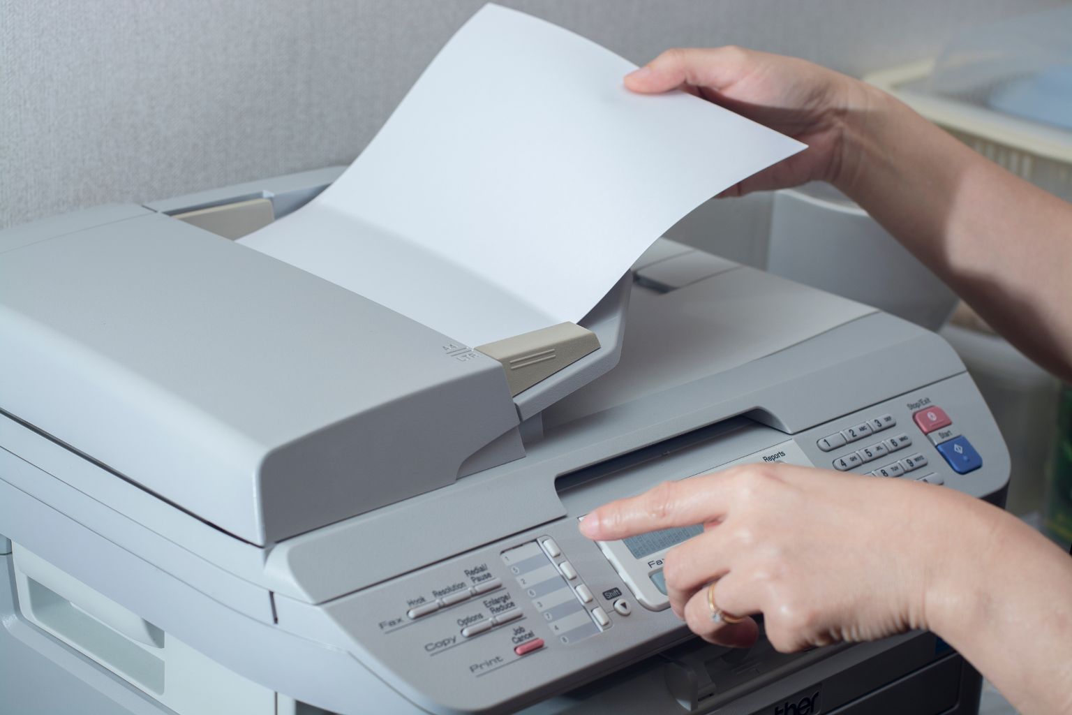 Person using fax machine