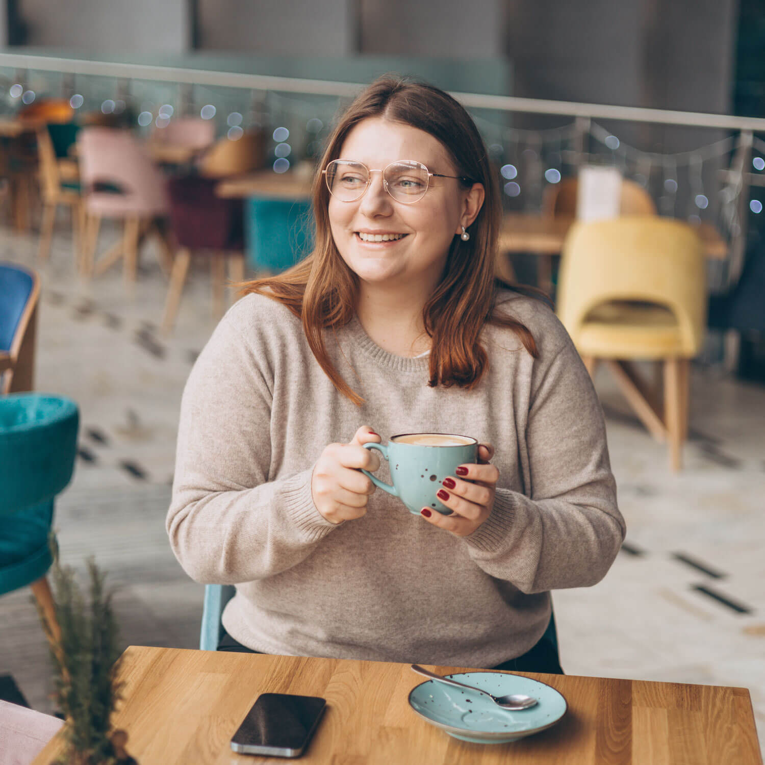 Woman enjoying coffee at a cafe