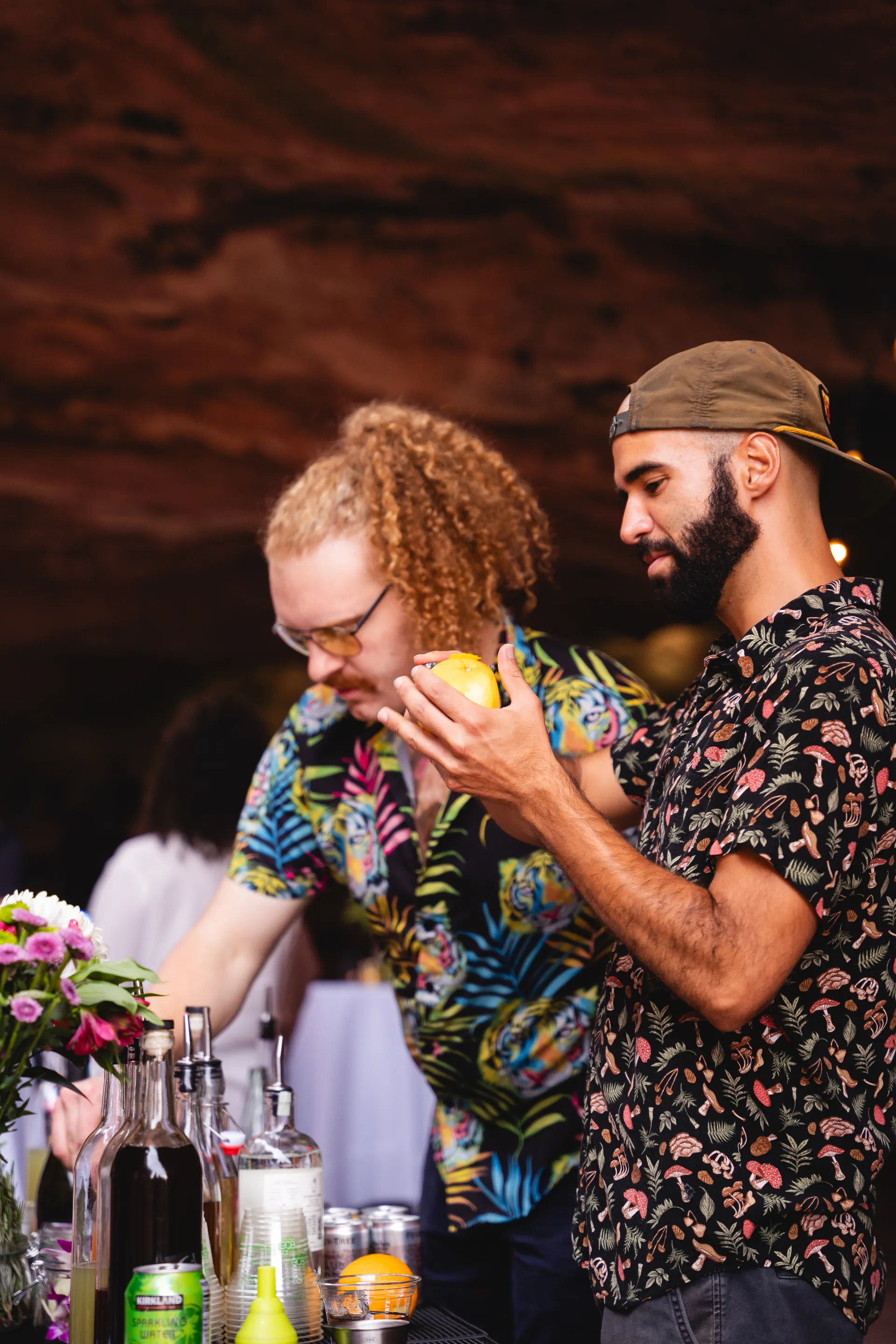 Two bartenders working together at an event
