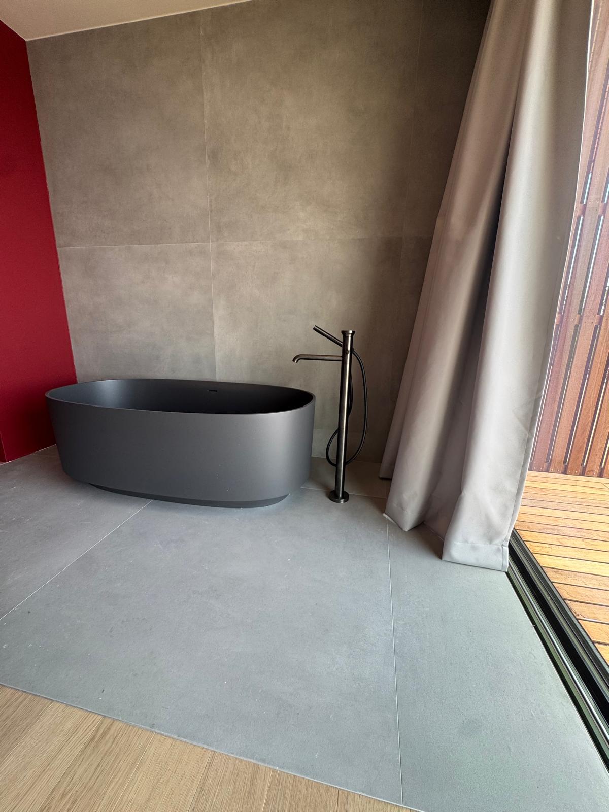 white ceramic sink beside window