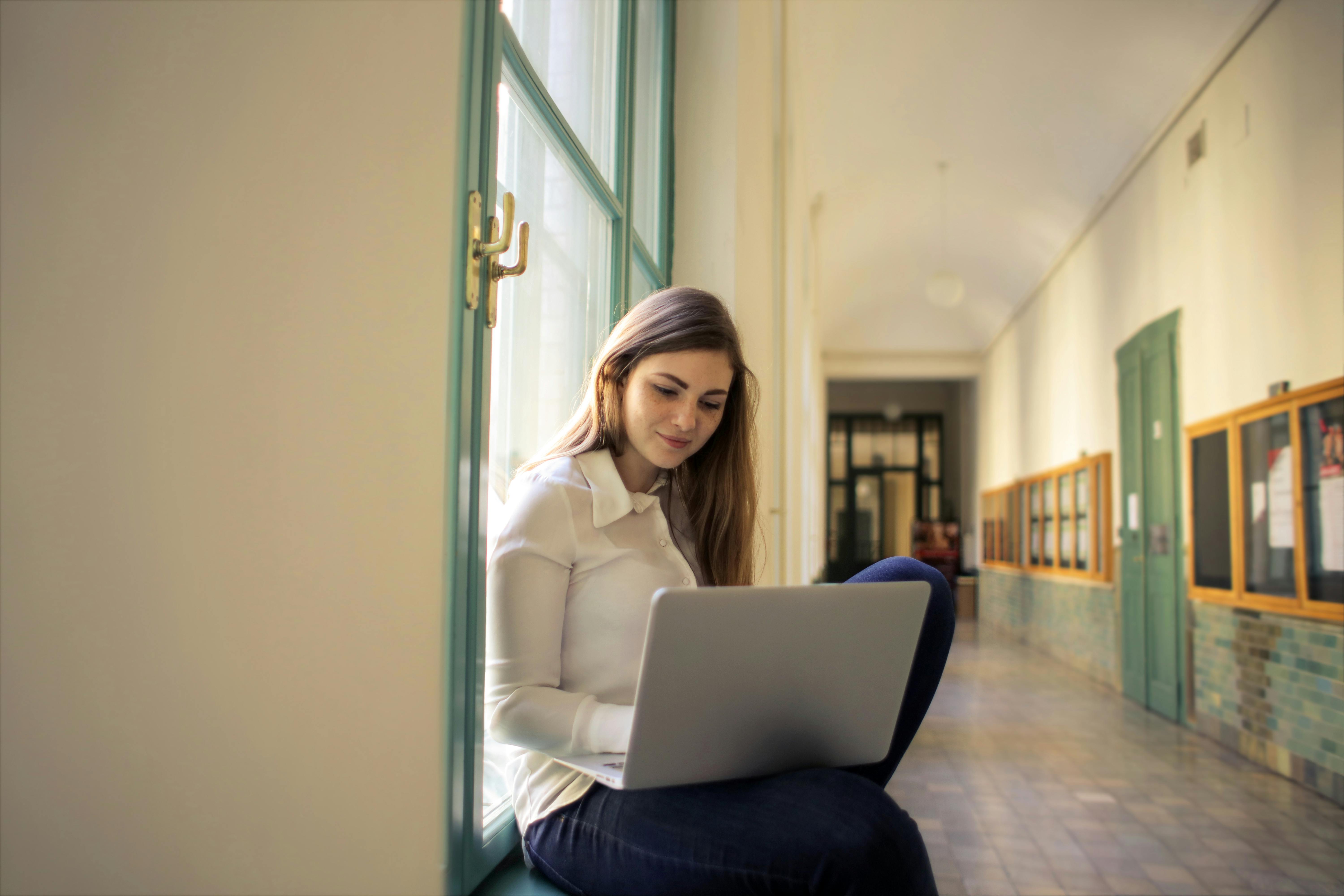 a student with a laptop studying