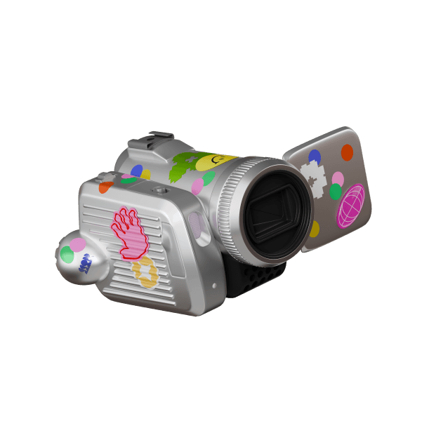 Silver camcorder decorated with colorful stickers. The stickers include a smiley face, hand, and various shapes.