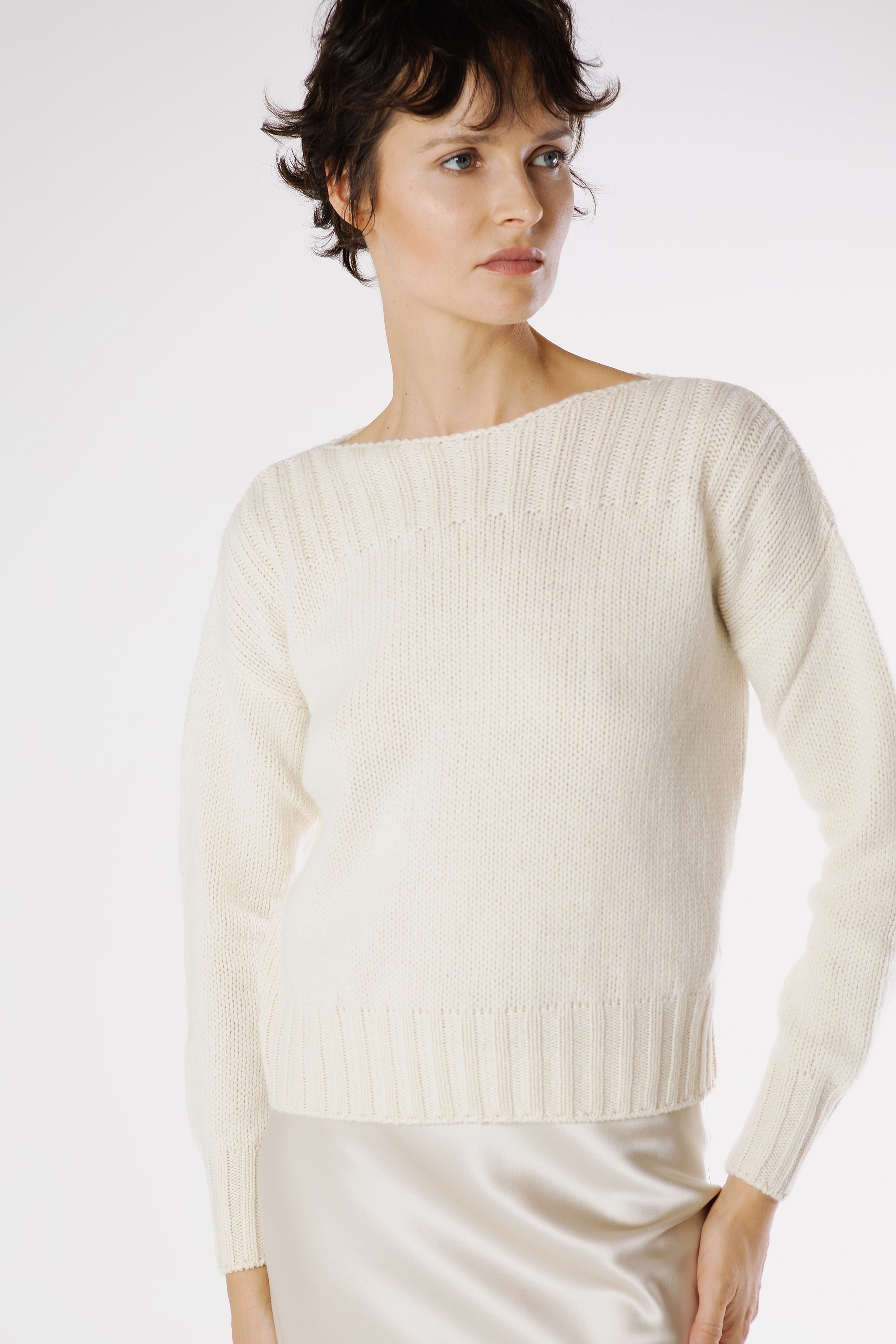 Model wearing the Amato Cashmere Pullover Lapponia styled with a fluid satin skirt for an effortless and refined luxury ensemble.
