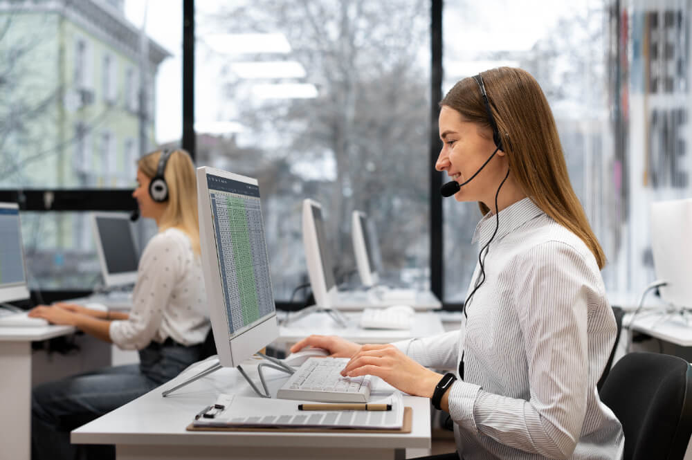 Customer service representatives using Voice AI technology to assist customers in a modern call center.