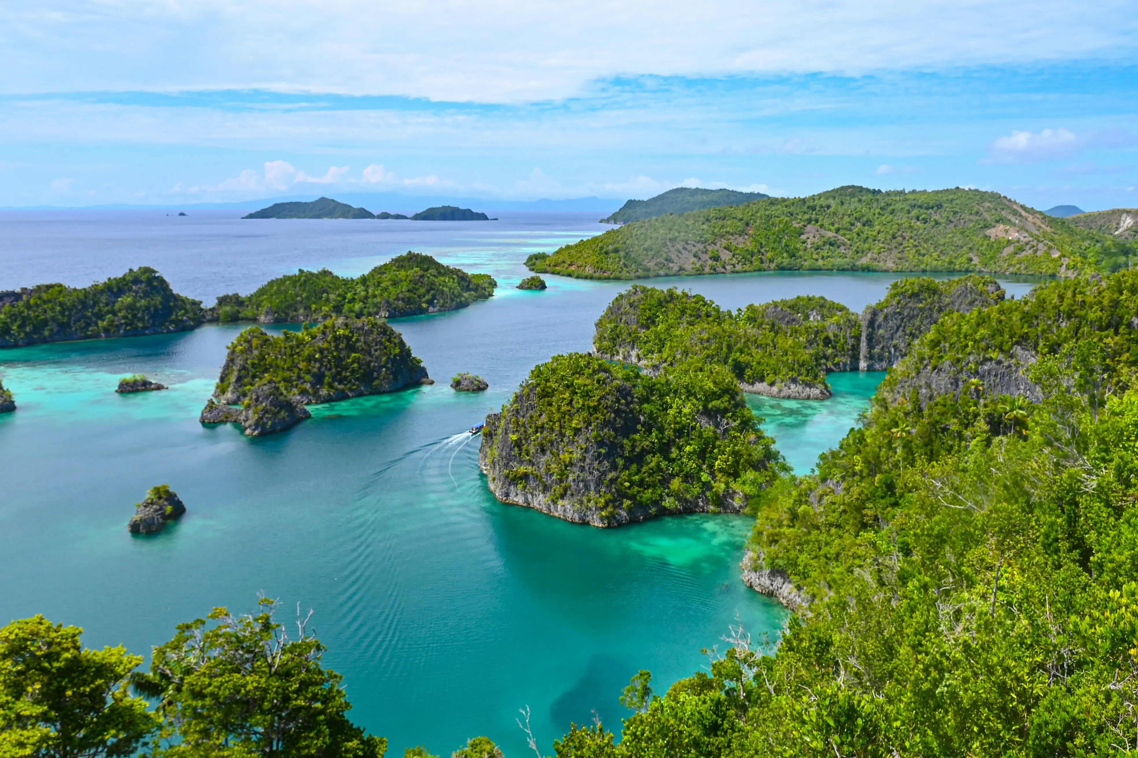 An aerial view of an island in the middle of the ocean